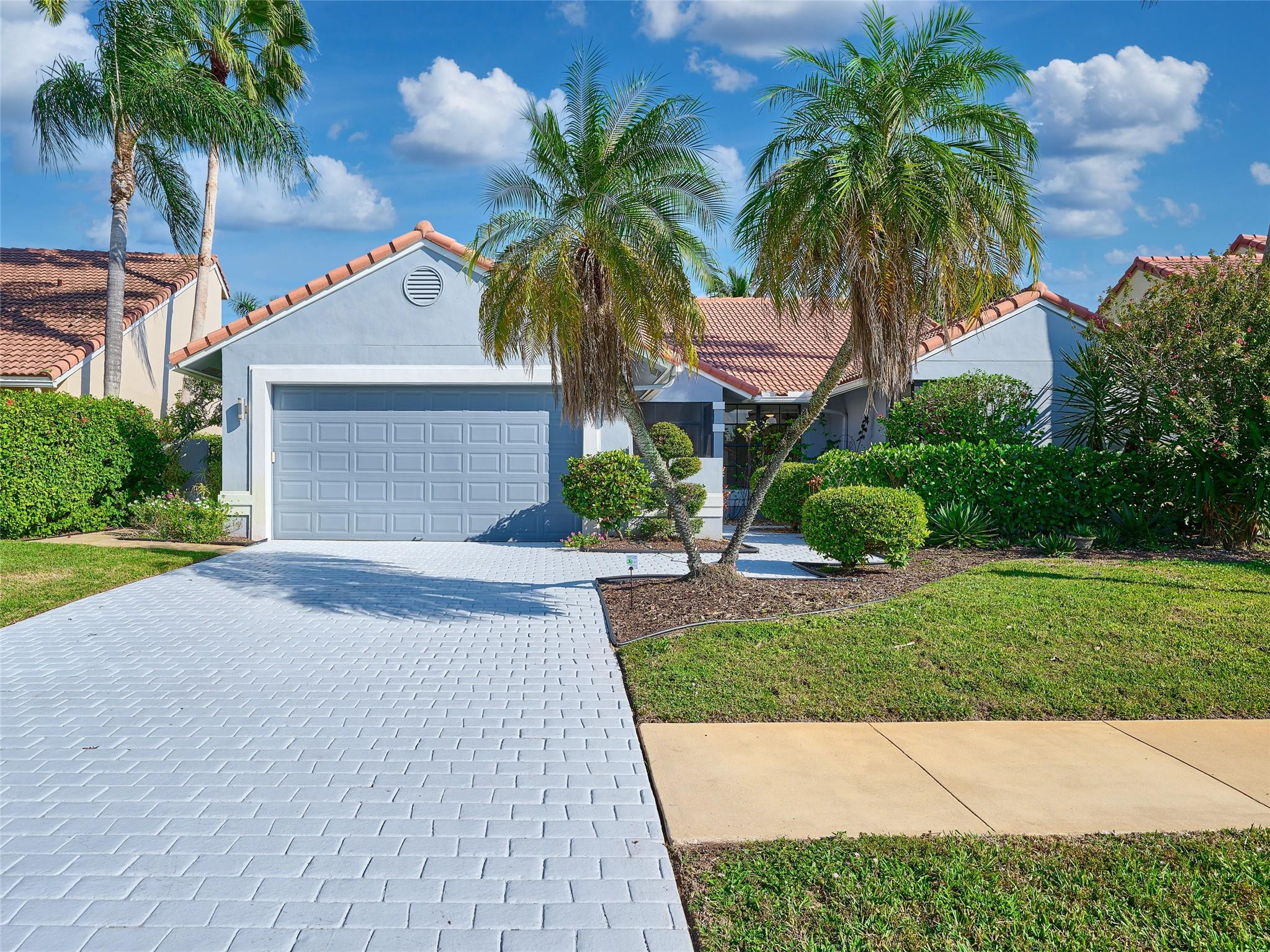Welcome to this stunning home offering exceptional golf course and lake views in the highly desirable Boca Greens gated community! This beautifully maintained home features a bright, open layout with an inviting kitchen, a comfortable split floor plan, and a resort-style patio with a renovated pool and pool equipment. The elegant travertine decking and a panoramic enclosure truly feels like paradise. Great location with highly desired A-rated schools, and plenty of amenities within the community!Boca Greens also offers residents the ability to play the Boca Greens Golf Club on a pay-as-you-play basis with no membership required. The community also provides 24/7 guard-gated security, and the low HOA fee includes a premium cable package and high-speed internet. A/C 2020.