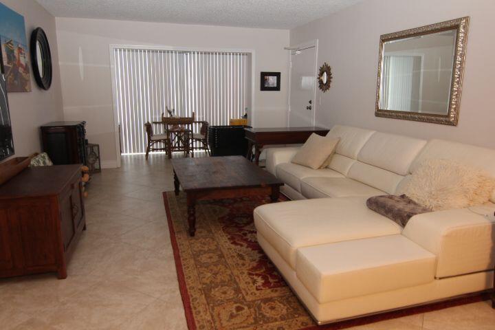 2/2 Annual unfurnished rental in the highly sought-after Bay Colony Club. Ground floor with impact windows throughout. One assigned parking space very near the front door plus adjacent guest parking spaces. Neutral tile floors throughout, featuring an enclosed balcony, which creates additional air-conditioned living space. Updated appliances in the kitchen. Updated bathrooms. There is also a washer and a dryer. Located in a gated waterfront community east of US1 on the Intracoastal waterway. This apartment is conveniently located near the community's entry, saving time getting to where you want to go. Residents enjoy exceptional resort-style amenities including four pools, three clubhouses, two fitness centers, six tennis courts, pickleball & barbecue areas.  The community is gated with a 24-hour staffed guardhouse. Association approval requires a minimum 700 credit score, no trucks or overnight commercial vehicles, and no pets, other than service animals subject to association approval.