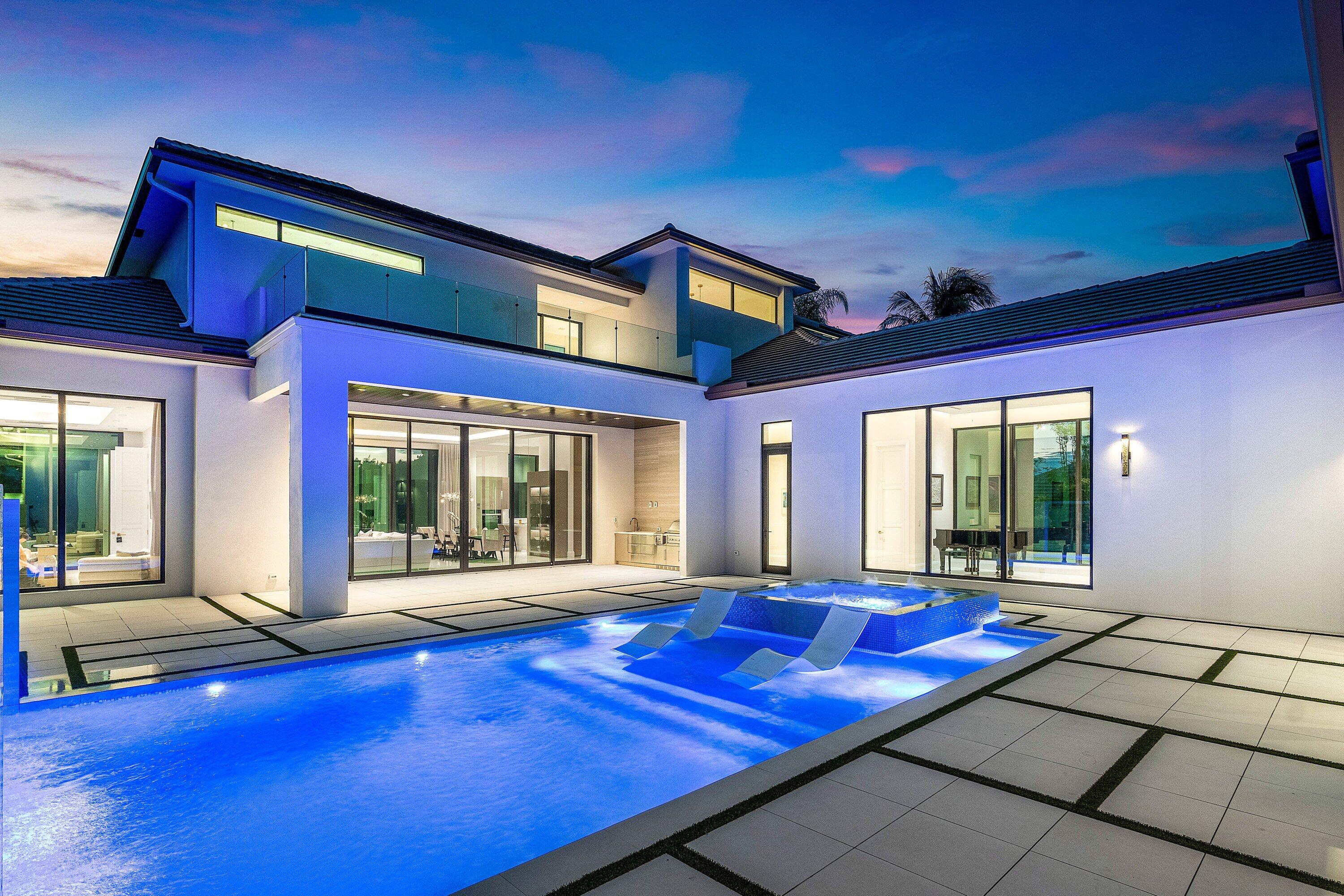 An architectural gem newly constructed in 2024, this custom-built courtyard home showcases expanses of glass that seamlessly integrate the indoor and outdoor environments. 12' glass windows and doors which frame eastern and western views illuminate the home with natural light. Modern design elements, coupled with hardscape accents in geometric form, create a stunning effect. The interiors have a refined, sophisticated aesthetic with soft tones and exquisite finishes. The home offers 5800 living sq ft, 4 ensuite bedrooms, 5.5 baths, office, entertainment room (which can be converted to a  5th bedroom with a full bath), temperature-controlled 200 bottle wine room, glass-railed floating staircase, music gallery, and 3 air-conditioned garage spaces (constructed to accommodate 6 cars using a lift). In addition to a spacious ground floor primary suite, upstairs there is a second primary suite and a large VIP bedroom.  The second floor also features a 32' balcony which overlooks the pool, interior courtyard, and waterfall fountain.  The rear of the home has an expansive view of the golf fairway of the SACC Championship course. Additional features of the home include Lutron lighting system; book-matched porcelain feature walls in both the entertainment and family rooms; Miele appliances including oven, microwave, warming drawer, steam oven, two  dishwashers; Sub-Zero refrigerator/freezer; water vapor, remote-controlled fireplace with LED lighting; 48x48 porcelain tile; motorized blinds; a water purification system; and a whole home generator.   St Andrews is a 24hr manned and gated mandatory membership country club community featuring 36 holes of championship golf, a full service 11,000 sq ft spa, multiple dining venues, a 20,000 sq ft tennis and fitness facility, 14 tennis courts and four pickleball courts, an aquatic center with three pools, playground & rec rooms and is recognized as an Elite Distinguished Club of the World, a Platinum Club of America, one of the Top Ten Healthiest Clubs in America, and received the 2019 North America Best Day Spa by World Spa Awards.   DISCLAIMER: Written & verbal information provided including but not limited to prices, measurements, square footage's, lot sizes, calculations & statistics have been obtained & conveyed from third-parties such as the applicable MLS, public records & other sources. All information including that produced by the Seller or Listing Broker/agent are subject to errors, omissions or changes without notice & should be independently verified by any prospect for the purchase of a Property. The Seller & Listing Broker/agent expressly disclaim any warranty or representation regarding all information. Prospective purchasers' use of this or any written & verbal information is acknowledgement of this disclaimer & that Prospects shall perform their own due diligence.