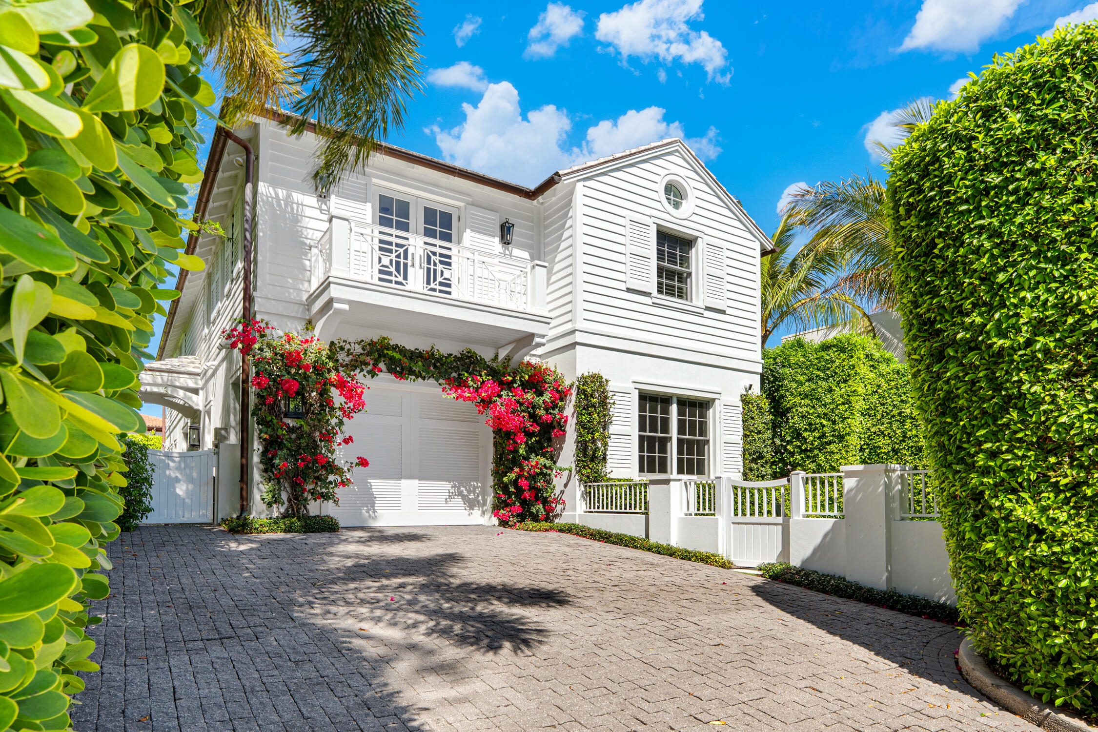 Gorgeous Island Style residence built in 2017 with the highest quality construction and finishes. Tastefully designed and furnished by Hive. Coveted in town location close to the town docks, park, bike trail, Four Arts, recreation center, beach, and the many shopping and eating establishments on Worth Avenue. This 4BR/5.1BA is light and bright offering an open floor plan with stunning coffered ceilings, a gourmet chef's eat-in kitchen with top-of-the-line appliances and finishes. The huge master suite includes a spacious sitting area, dual baths and dual walk-in closets. Additional highlights include a gorgeous heated pool, wet bar, elevator, garage, and generator. This home is turn-key - no renovation or furniture necessary! Move right in and enjoy Palm Beach