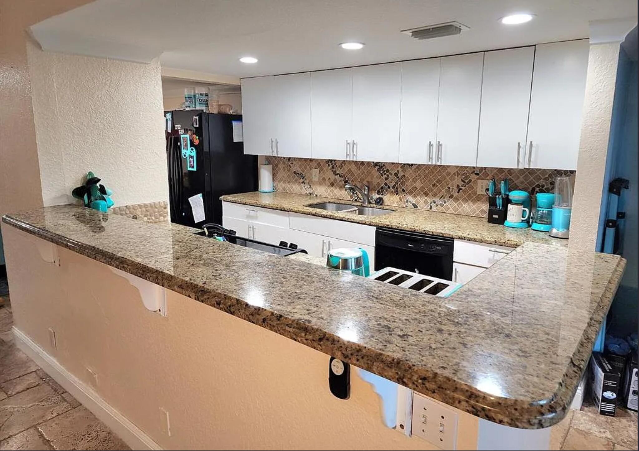 Seller offering $10,000 toward the buyer's closing costs and prepaid (fully negotiable)!  Beautifully renovated and FHA-approved, this stunning Sunrise home offers over 1,600 square feet of living space and features impact-resistant doors and windows,  marble flooring, and an open-concept kitchen with granite countertops.  Recent upgrades include a 2021 roof replacement, 2020 A/C system, new air ducts, and new insulation for enhanced comfort and energy efficiency. The home also boasts updated bathrooms, two private balconies, and a covered, screened-in patio perfect for relaxing or entertaining.  The garage has been professionally converted into a versatile space ideal for a 4th bedroom, home office, gym, or playroom, with the option to easily restore it to a garage if desired.  GPS location is accurate...