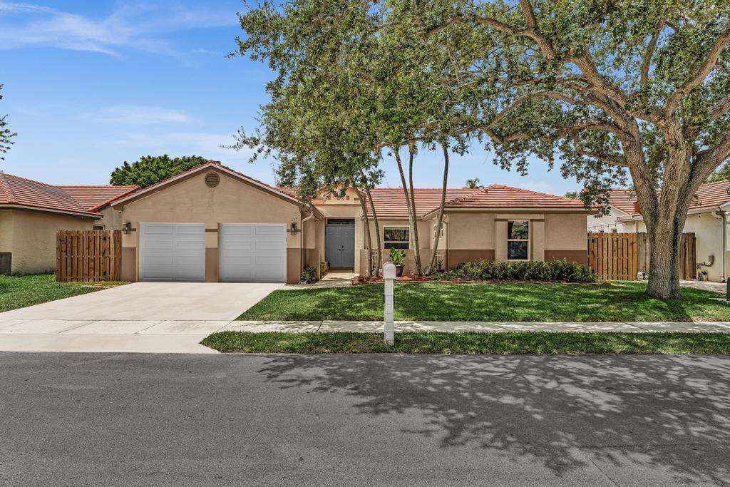 Welcome to this spacious 3-bed, 2-bath single-family home featuring vaulted ceilings & desirable split-bedroom floor plan. The oversized primary suite easily accommodates a king-size bed & offers a spa-inspired bathroom with a relaxing soaking tub & shower. The open-concept kitchen is designed for everyday living & entertaining with an island, granite countertops, & stainless steel appliances. Hurricane impact windows & doors provide peace of mind. Enjoy indoor-outdoor living on the expansive screened patio with an extended covered roof perfect for a hot tub or entertaining, plus a new charming front wood patio. Large  backyard has a new fence (2025) & offers  room for a future pool. Complete with a 2-car garage, NEW washer & dryer, and access to Coral Bay's community amenities.