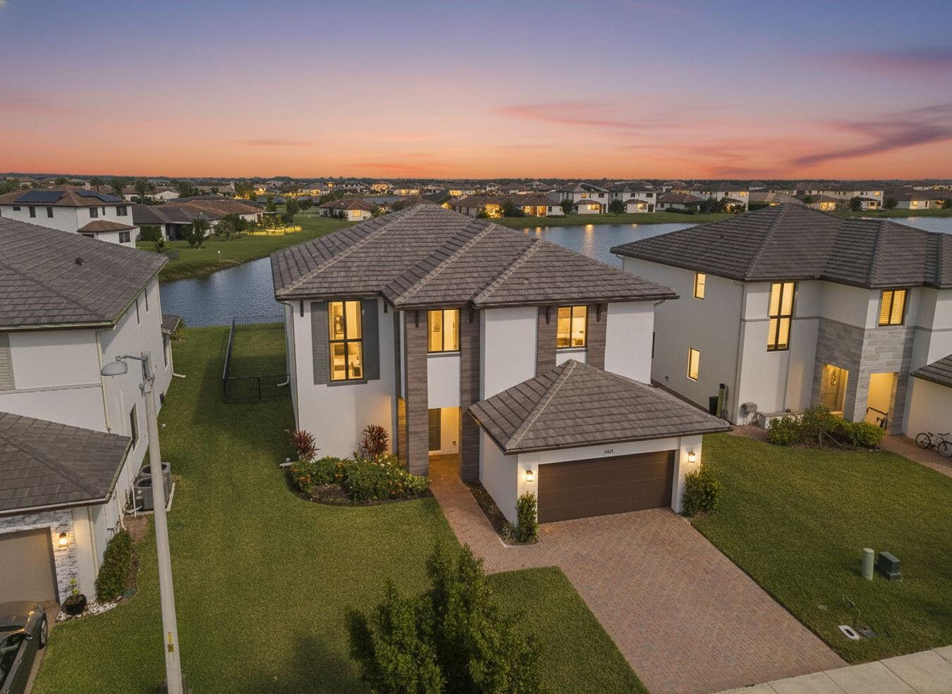 Welcome to 5032 Frattina St., a beautifully maintained 2022-built two-story home in the desirable Maple Ridge community of Ave Maria. Offering over 3,300 sq. ft. of bright, open-concept living, this residence features impact windows, a fenced backyard, and a screened lanai with tranquil lake views. The gourmet kitchen includes stainless steel appliances, quartz countertops, modern cabinetry, and a large island ideal for entertaining. Upstairs, a versatile loft complements a spacious primary suite with walk-in closet and spa-style bath. Additional features include built-ins, central A/C, and a 2-car garage. Enjoy resort-style amenities including clubhouse, pool, fitness center, pickleball, tennis, dog park, and scenic trails, all near schools, shopping, and Ave Maria town center.