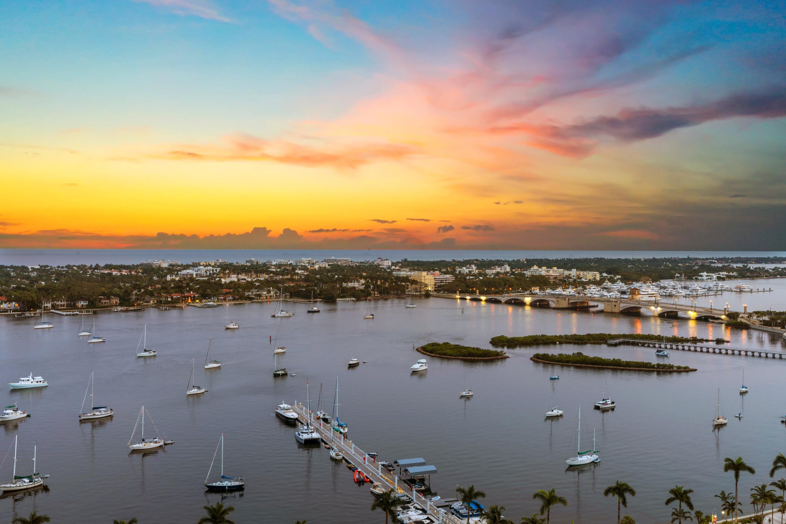 Experience elevated downtown living at its finest from this exceptional residence in the highly desired Esplanade Grande, ideally located in the heart of West Palm Beach's prestigious Waterfront District. Blending sophistication, comfort, and an unmatched location, Residence 1102 offers an extraordinary opportunity to enjoy luxury living in one of downtown's most distinguished addresses. Recently enhanced with thoughtful designer upgrades, the residence features custom high-end plank wood flooring, fresh interior paint, elegant new designer hardware, and detailed custom millwork that elevate the home's refined aesthetic.  Designed for both sophisticated entertaining and comfortable daily living, the expansive floor plan offers generous living and dining spaces that seamlessly connect to the stunning views beyond. The chef's kitchen is equipped with premium appliances, including a Sub-Zero refrigerator, Wolf cooktop, hood and microwave providing exceptional convenience for entertaining and culinary enthusiasts alike.  A custom designed bar area creates the perfect setting for hosting guests, complete with dual wine refrigerators and ample space for serving and display.  The spacious primary suite serves as a private retreat, while additional guest accommodations provide comfort and flexibility for family, friends, or a dedicated home office.   Adding to the convenience and value of this exceptional offering are two dedicated parking spaces and a large storage unit, a highly desirable feature in downtown West Palm Beach. Residents of Esplanade Grande enjoy an exceptional collection of amenities, concierge services, and the prestige of one of downtown's most sought-after luxury buildings. Just steps away are the Intracoastal waterfront, Clematis Street, premier dining, luxury shopping, cultural attractions, and the vibrant energy that has made West Palm Beach one of South Florida's most dynamic destinations.