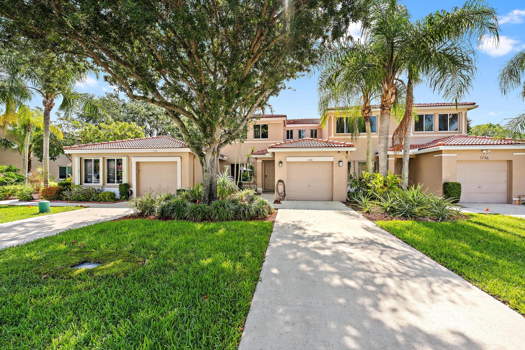 Beautifully updated 3-bedroom, 2.5-bath townhouse with a 1-car garage located in the highly desirable Harmony Lakes community! This move-in ready home features new roof from 2022, fresh interior paint, a beautifully renovated kitchen with newer shaker-style cabinets, updated bathrooms, and new flooring throughout. The spacious eat-in kitchen is perfect for everyday living and entertaining, while the primary suite offers a walk-in closet for added convenience. Enjoy peace and privacy with no rear neighbors and relaxing views of the large grassy area behind the home. Additional features include hurricane shutters and plenty of natural light throughout. Harmony Lakes offers fantastic community amenities including a pool, tennis courts, racquetball, BBQ area, and playground. Conveniently