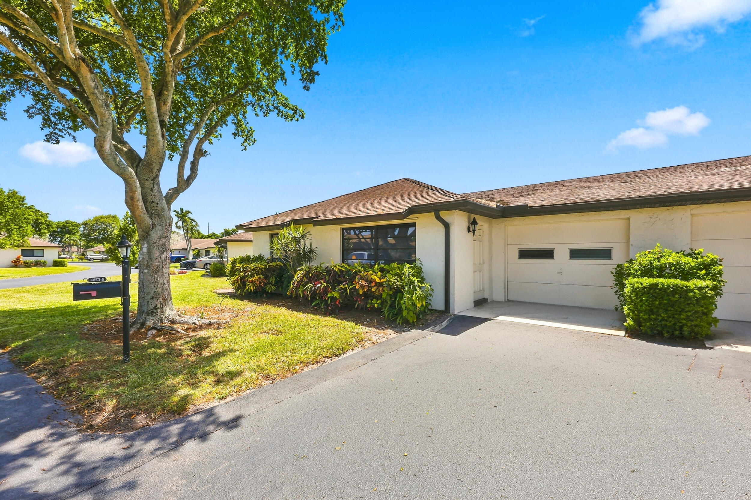 Welcome to Greentree Villas, vibrant 55+ living in the heart of Boynton Beach! This 2BR/2BA single-story villa offers 1,400 SF of bright living space, tile floors throughout, walk-in closet, pantry, and a 1-car attached garage PLUS covered carport. The kitchen and bathroom have been fully renovated. The HOA fee is a standout  value covering cable TV, internet, water, sewer, trash, lawn care, pest control, insurance and community pool. Home is being sold unfurnished and ready for your personal touch. Steps to the pool and shuffleboard, minutes to beaches, shopping, dining and I-95. Priced to move, cash or conventional welcome. Schedule your private showing today!