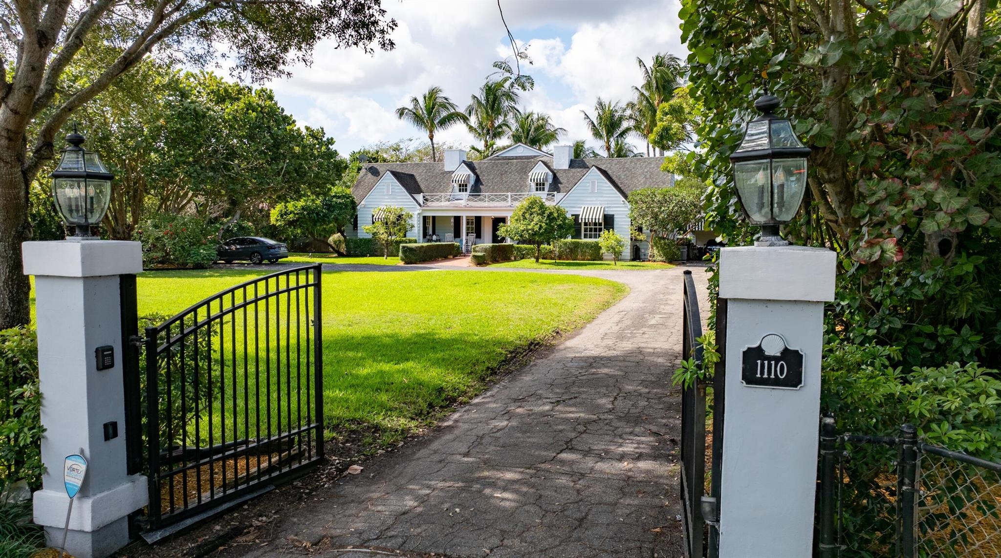 An exceptional offering, this 1936-era historic colonial-farmhouse-style estate presides over 1.3 acres of lushly landscaped grounds graced by majestic banyan trees, sprawling lawns and billowy palms. Seamlessly combining the classic traditions of its vintage heritage with gracious modern appointments, this extraordinary residence is astutely reimagined for today's refined style of living. North Swinton Avenue, Delray Beach, Florida. A beautifully preserved oceanfront community, Delray Beach lies in the heart of Florida's Gold Coast between Boca Raton and Palm Beach. Affording splendid scenery along nearly two miles of Atlantic coastline, Delray Beach is known for its magnificent award-winning beaches. A vibrant downtown district offers a wide array of charming shops, galleries, cafés and gourmet restaurants on picturesque Atlantic Avenue.

PROPERTY: 
 
Ideally suited for quiet relaxation and outdoor entertaining on lushly landscaped 1.3 acres graced by majestic banyan trees, sprawling lawns and billowy palms, this historic gated estate features shaded loggias with tongue-and-groove ceilings, a screened gazebo, and view-filled terraces overlooking the large, sun-dappled saltwater pool.

RESIDENCE:  

Reimagined for today's sophisticated style of living, this Delray Beach colonial-farmhouse estate, designed by renowned architect Gustav Maass, seamlessly combines the classic traditions of its 1936 heritage with  gracious modern appointments. Comprising five bedrooms and 6,499± total square feet, plus a separate 814± square-foot guest house, the main residence of this estate is introduced by an inviting Chicago-brick porch, which flows into the chic paneled living room, highlighted by a fireplace and topped by the original tongue-and-groove beamed ceiling, combining legacy features with an elegance that welcomes. Also crowned by the same ceiling details, the adjoining dining room offers an abundance of charm along with a light, bright ambience, with French doors that open to the pool patio. The epicurean kitchen, a chef's dream, is fitted with custom wood cabinetry, quartz countertops, a breakfast bar, Chicago-brick flooring, top-of-the-line appliances, and a separate butler's pantry. Adjacent to the kitchen, the family room showcases built-in corner cabinets and Dade County pine floors. Completing the first-floor layout are a powder room, ensuite laundry, full bathroom, and two guest bedrooms, with one boasting a window seat. The split bedroom plan provides privacy, with the primary suite, a serene retreat, presiding over the second floor. Highlights in the bedroom include a cove ceiling, plantation shutters and French doors that open to the pool-view balcony. The suite also comprises a private sitting room, walk-in cedar-lined closet, and a recently renovated master bathroom appointed with tile floors, large multi-head shower, and freestanding soaking tub. With a separate entry offering guests their own intimate escape, the enchanting guest house comprises a living room with a fireplace, a renovated kitchen, bedroom suite, screened Florida room, and a covered brick patio overlooking the pool. Also on the grounds is a two-car garage. Details throughout include wood tile flooring, handsome moldings, touches of cypress, and partial impact windows and doors. 

The information herein is deemed reliable and subject to errors, omissions or changes without notice.  The information has been derived from architectural plans or county records. Buyer should verify all measurements

DISCLAIMER: Information published or otherwise provided by the listing company and its representatives including but not limited to prices, measurements, square footages, lot sizes, calculations, statistics, and videos are deemed reliable but are not guaranteed and are subject to errors, omissions or changes without notice. All such information should be independently verified by any prospective purchaser or seller. Parties should perform their own due diligence to verify such information prior to a sale or listing. Listing company expressly disclaims any warranty or representation regarding such information. Prices published are either list price, sold price, and/or last asking price. The listing company participates in the Multiple Listing Service and IDX. The properties published as listed and sold are not necessarily exclusive to listing company and may be listed or have sold with other members of the Multiple Listing Service. Transactions where listing company represented both buyers and sellers are calculated as two sales. "No payments made until title passes" Some affiliations may not be applicable to certain geographic areas. If your property is currently listed with another broker, please disregard any solicitation for services. Information published or otherwise provided by seller, listing company or its representatives is deemed reliable but are not guaranteed and subject to errors, omissions, or changes without notice. Copyright 2024 by the listing company. All Rights Reserved.