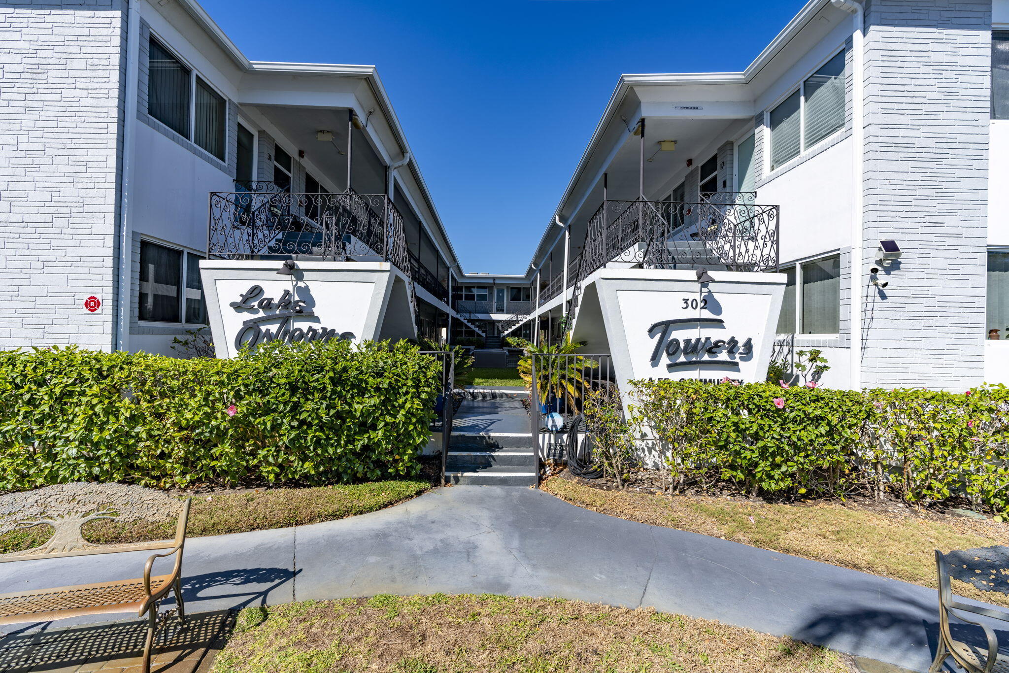 Enjoy easy 55+ living in desirable Lake Worth Beach! This cozy and functional condo in sought-after Lake Osborne Towers offers a truly low-maintenance lifestyle. The HOA covers water, lawn care, pest control, and building maintenance keeping daily living simple and worry-free. Impact windows and a hurricane-rated front door provide added peace of mind, and one assigned parking space is included. Just 200 feet from Lake Osborne, enjoy morning sunrises and evening sunsets steps from your door. Close to shopping, dining, and entertainment. Application and approval required prior to closing. This is a cash-only condo purchase. Please note this is a co-op property. Rentals are not permitted. Pets are allowed; however, only cats are permitted. Furniture is negotiable!