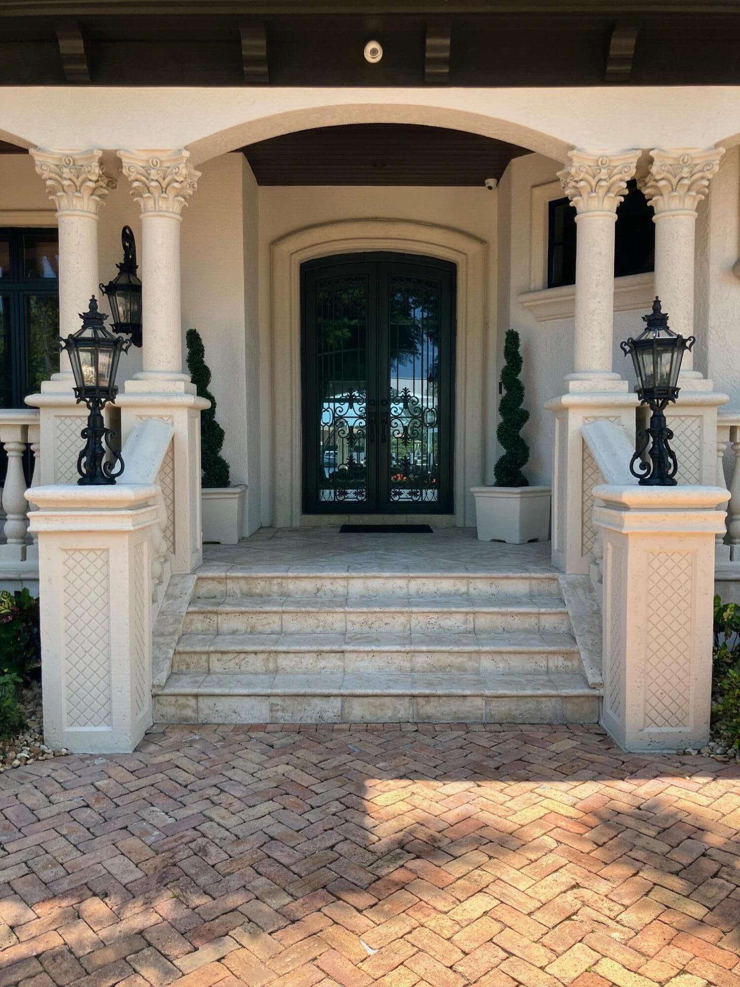 Experience Lighthouse Point's unparalleled waterfront living in this classic coastal-style estate home. This home's versatile floor plan is meticulously designed and crafted. Emulating its coastal surroundings, each element of this home has been curated to enhance functionality and style with sophisticated finishes, high-end design details, and thoughtful elements to enrich everyday life. Situated on 108 feet of water frontage, you will enjoy the long, spectacular sunset views from your observation deck while lounging at your resort-style custom tiled pool with 12 person jacuzzi and summer kitchen. A boater's dream location extra wide turning basin, with extra deep water dock upgraded electrical power, This one-of-a-kind property includes a private workout room, theater, see supplement in