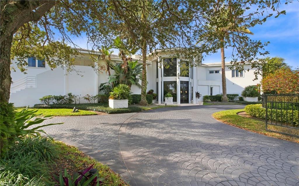 Discover this magnificent, wide waterfront estate in the spectacular location of Sewall's Point featuring the most breathtaking Inlet views! This 3 story, 15,700+sqft home offers 8 beds, 8 full and 2 half baths, & a guest suite with full kitchen. Other features include an elevator, spiral staircase, 3 kitchens, wet bar, library, electric power shutters,  2 gas fireplaces and marble floors. Kick back in the ultra-luxury theater room or enjoy a workout in the home gym w/ sauna. The master suite offers a sitting area, glass doors out to the waterfront patio, dual sinks, spa tub & shower & oversized walk in closet. The views and river breezes never end with your 3 story patio. Step outside to a luxurious outdoor patio with pool & gazebo. The private dock has plenty of room to host your boats!