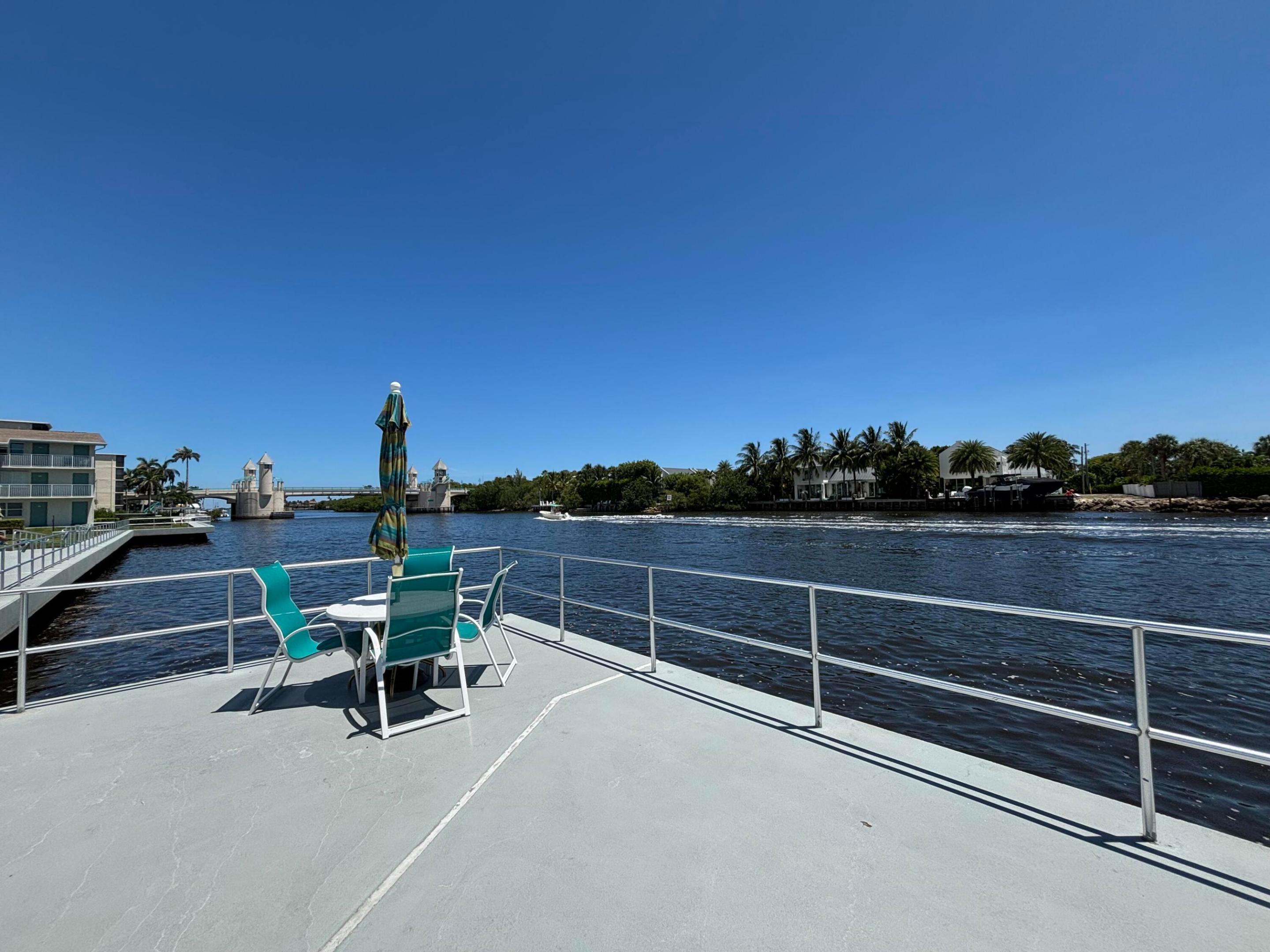 1st floor unit steps away from the community boardwalk. Watch the boats go by from your porch! Central A/C. Impact windows & doors.