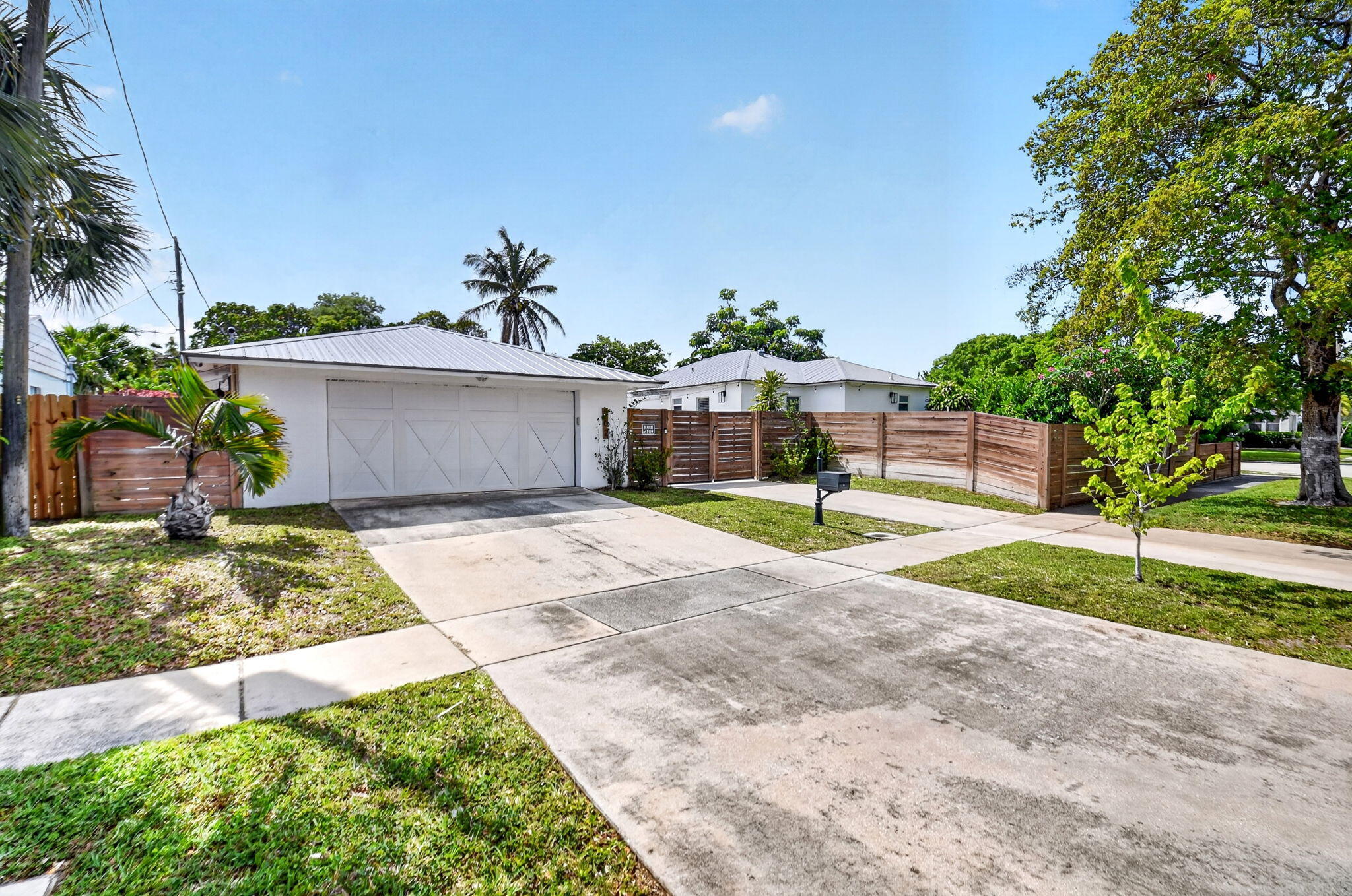 Discover the potential at 702 Forest Hill Blvd in West Palm Beach! Situated on a generously sized ~0.25-acre lot, this property presents a unique opportunity for investors, builders, or homeowners ready to renovate or reimagine. The home was originally a 2-bedroom, 2-bath residence and has been converted into a spacious 1-bedroom, 2-bath layout, offering approximately 874 sq ft of living space. In addition, the garage has been finished with its own bathroom providing an extra 574 sq ft of air conditioned space—ideal for a studio, office, or extended living area. With ample outdoor space, there's plenty of room to expand, add a pool, or create the ultimate backyard retreat. Conveniently located along Forest Hill Blvd, a major east-west corridor in Palm Beach County, Great opportunity at 702 Forest Hill Blvd in West Palm Beach! This home sits on a large lot with plenty of space for outdoor living, entertaining, or future enhancements. The garage has been converted into an air-conditioned space with its own bathroom, offering flexibility for guests, extended family, or a home office. Ideal as a starter home for a family or a solid opportunity for an investor. Conveniently located near I-95, shopping, dining, and just a short drive to the beach. RV negotiable. Don't miss this well-located property with great potential!