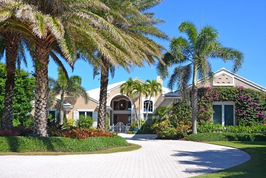Breathtaking harbor views greet you from walls of impact glass as you walk through the stunning Mahogany front door of this waterfront estate home. Totally and beautifully renovated, the interior features offer an expansive living room accented by clerestory windows, custom built-in display wall and a volume coffered ceiling. Sumptuous marble floors grace all main living areas.  An elegant formal dining room is steps away from the 650 bottle wine cellar with dedicated climate control. The consummate cook will relish in the gourmet kitchen which boasts double islands, granite counters, a large walk in pantry, a cozy breakfast nook. Top of the line appliances include Miele wall-oven, induction cooktop, Thermador refrigerator and two dishwashers. The adjacent spacious family room contains its own beverage refrigerator in a custom built-in hutch and offers ample room for a game table and comfortable seating for casual entertaining.   Relax in the exquisite master suite highlighted by his and her walk-in closets, a tray ceiling and sitting area with harbor views and private access to the marble pool deck.  The luxurious master bath features separate vanities and water closets, spacious shower and Victoria & Albert soaking tub.  Two en suite guest rooms as well as an ensuite office/bedroom, all with hardwood floors, complete the accommodations.  Cutting-edge technology throughout the residence includes a Crestron Smart Home system, whole house Wi-Fi and programmable lighting inside and out.  Outdoors, the spacious covered patio is enhanced by a Summer kitchen with gas grill, full cabana bath and open patio leading to a private Brazilian IPE wood dock with lighting, water and accommodation for multiple boats with two lifts, 30,000 lb and 16,000 lb.  Harbor sunsets are yours to be savored from this elegant waterfront home.