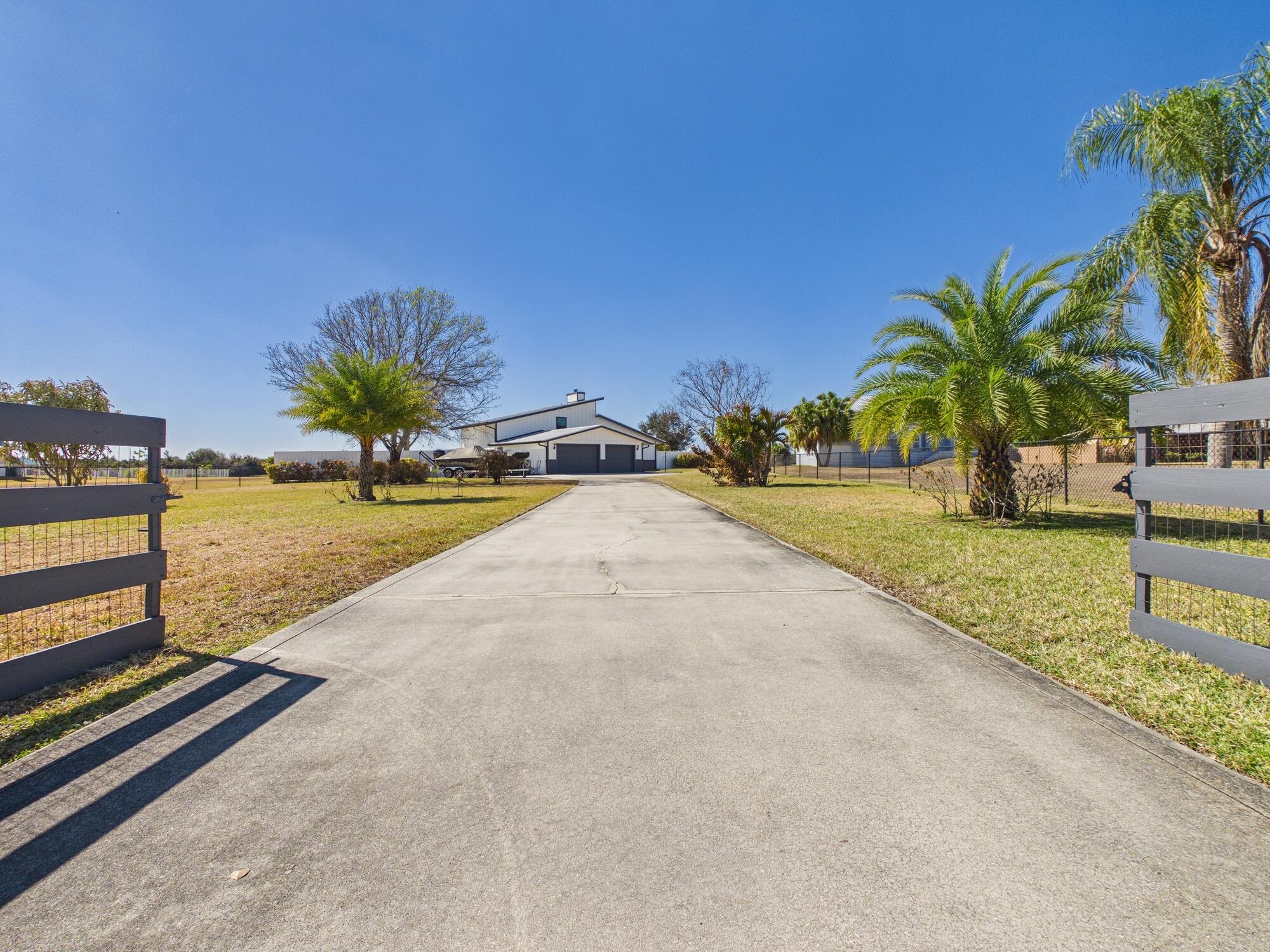 This beautifully updated waterfront home offers the perfect blend of comfort, functionality, and Florida outdoor living with direct lake access. Inside, two separate sets of three-panel retractable sliding doors create a seamless indoor-outdoor flow and fill the home with natural light and water views. The newly renovated kitchen features ample cabinetry, modern finishes, and a large walk-in pantry, while a dedicated office and abundant storage add flexibility and convenience. Outside, enjoy a fully fenced yard, multiple screened-in patios, and a stunning outdoor entertaining area with a fire pit. Ideal for boating, fishing, or relaxing by the water, this home offers a rare opportunity to enjoy true waterfront living.