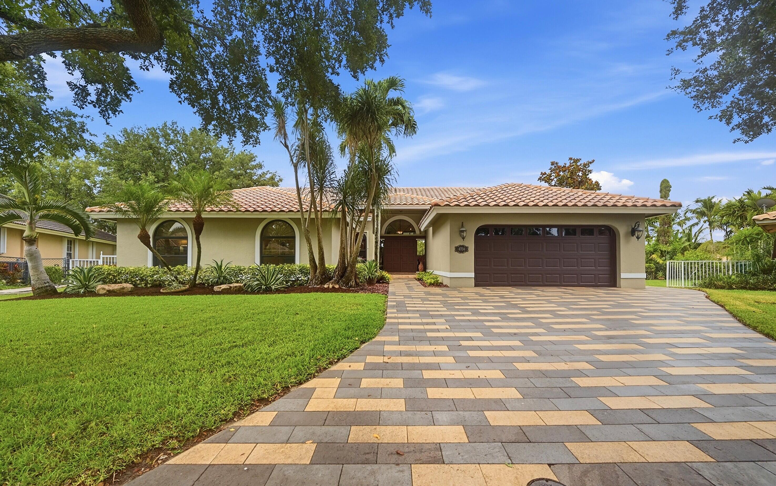 **ACCEPTING BACKUP OFFERS** Exceptional waterfront living on an oversized CUL-DE-SAC lot with 180 FT OF WATERFRONT in the NO-HOA community of North Springs. COMPLETELY REMODELED home showcases LUXURY & DESIGNER finishes thru out incl imported Italian marble flooring, stunning custom CHEF KITCHEN w/ glass display cabinetry, designer lighting and premium fixtures. Renovated baths with custom cabinetry, marble/quartz counters, ledger stone, curbless shower in the primary bath, frameless shower doors & sophisticated finishes. Generously sized bedrooms w/ custom closet systems. Seamless indoor-outdoor living in a tropical setting is perfect for relaxation & entertainment with its oversized pool and lg covered lanai. Complete WINDSTORM PROTECTION thru out incl IMPACT GLASS. This home has it all!