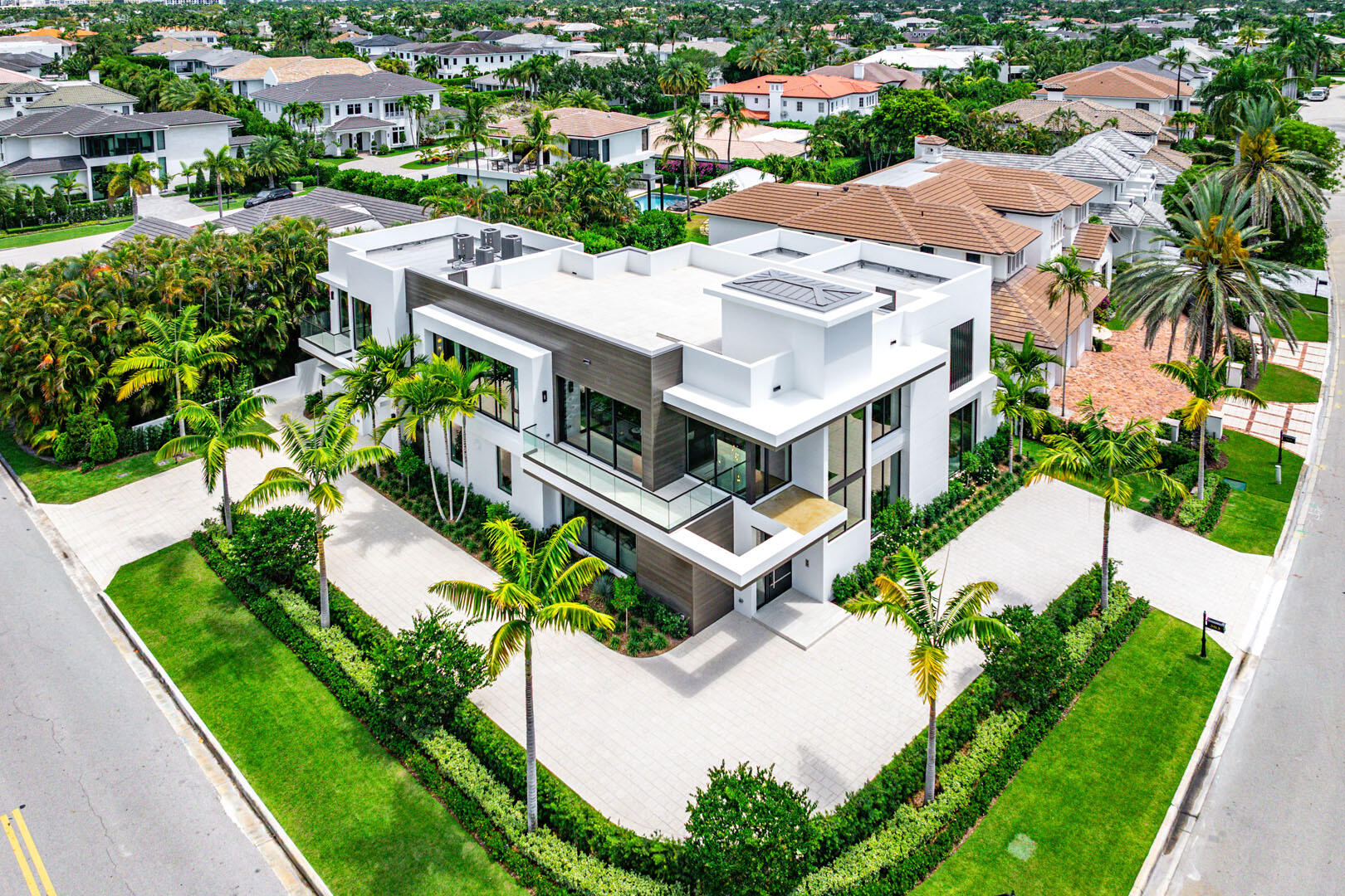 Designed by Randall Stofft Architects, built by Compson Homes, and styled by Lesly Maxwell Interiors, this residence is a modern sanctuary that blends sleek design with natural textures and bohemian influences. From the moment you enter the striking two-story foyer, expansive windows, and clean architectural lines create an inviting yet sophisticated ambiance. The great room, bathed in natural light, seamlessly connects to the covered loggia through oversized sliding doors, allowing for effortless indoor-outdoor living. A gourmet kitchen centered around a stylish eat-in island is complemented by premium stone countertops and a fully built-out pantry. The club room, complete with a wet bar, offers the perfect space for entertaining, leading directly to an outdoor terrace.    Outside, this home is an entertainer's dream. The tranquil backyard boasts a resort-style pool, spa, sun shelf, and firepit, evoking a private resort experience. A summer kitchen featuring a 36-inch stainless steel grill, refrigerator, and ice maker makes outdoor dining effortless. The lush, illuminated grounds enhance the striking modern design of this coveted corner-lot residence. Control4 smart home system automates every detail of this estate, and is masterfully curated to deliver a lifestyle of unparalleled sophistication and comfort. Buyer to pay documentary stamp taxes on the deed and title insurance.