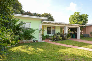 Art Deco Beauty in College Park. This wonderful home has 2 bedrooms, 1 bath, and lives large!  Great, spacious rooms, updated kitchen, lovely family room and more.  A covered porch serves as a very private entry to this wonderful home.  Newer wood floors with high shine and designer touches have been installed troughout.  The large, living/dining area with adjacent open kitchen is perfect for today's entertaining with a "Great Room" vibe. Granite counter tops enhance the 13X9 kitchen, with access to a generous carport with laundry facilities.  The dining room features French doors opening to a wonderfully light and bright Florida room surrounded by windows and with a period cracked tile floor.Two spacious bedrooms are off the hallway separated by a roomy bath with combination tub/shower.
