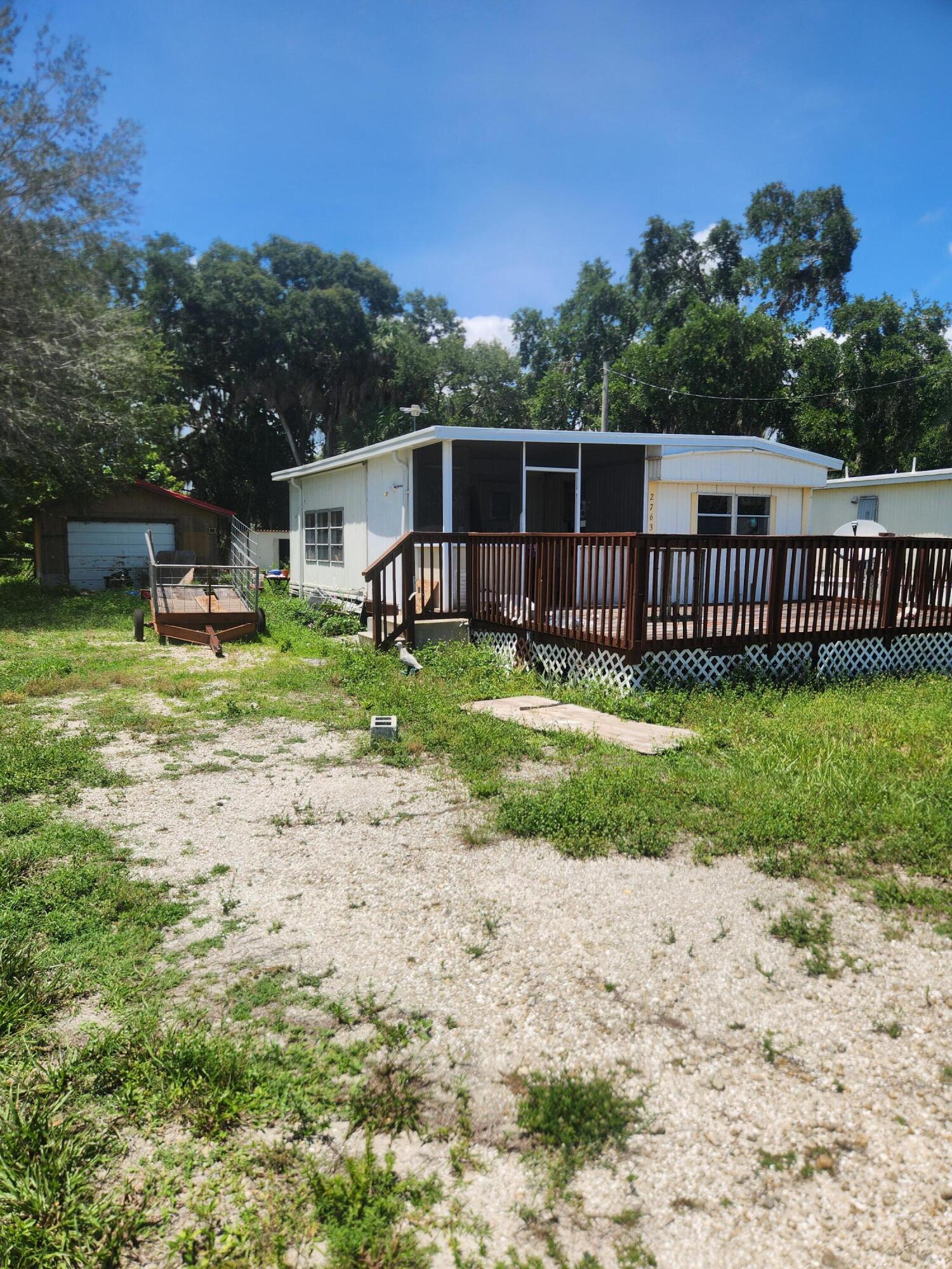 Welcome to this 2 bed 1.5 bath mobile home in Lakeport with canal view. This is an excellent opportunity for value add with some renovation this will make a great first time home or winter retreat. Plenty of storage with the extra out buildings and detached garage. Owner is motivated and willing to look at reasonable offers with cash or conventional financing.