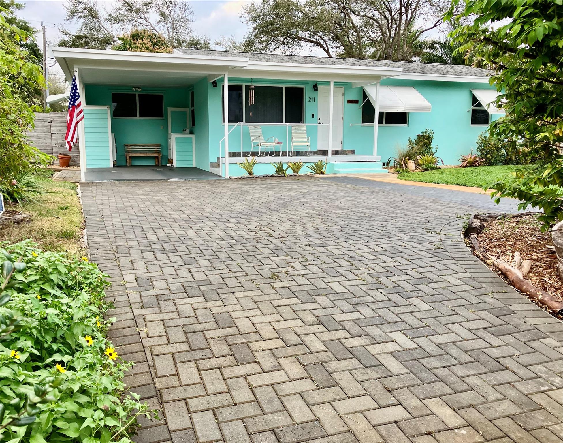 The premier location at 1.2 miles to the beach, short walk to the new City Hall, restaurants and shops. Bring your boat, huge .224/acre private lot, fenced. No HOA, turn-key, this smart home features original hardwood floors throughout except for tile in the updated bathrooms and wood laminate in the updated kitchen. Granite countertops in the kitchen. 6 inch baseboard trim throughout. Crown molding in the living and dining room. All windows and doors are High Impact Miami-Dade Hurricane Rated. Surrounded by a lush garden of Florida-Native's and tropical fruit trees. Huge paved driveway plus a covered carport can fit 4 vehicles easily. A/C and roof are in great condition. All newer plumbing. A true South Florida gem that won't last! Call or text listing agent for easy showing appointment. 2/3 bedrooms with custom closets. Plenty of storage. Property sits over 30 feet above sea level, no flood zone. Working well irrigation. No cast iron, no popcorn ceilings, home is updated and meticulously maintained. Convenient Residential/Commercial zoning ready for your ideas.
