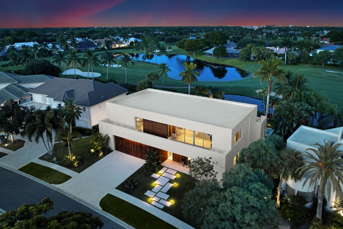 Villa Mallorca is a striking and sophisticated architectural masterpiece, designed by the renowned Spanish architect Jorge Bibiloni Studio and developed by Meir Kroll of Always Construction Inc. Nestled in the prestigious gated community of Boca Grove in Boca Raton, Florida, this newly built residence epitomizes modern European luxury with unparalleled quality, elegance and refined minimalism. Designed with sophisticated contemporary European influences, Villa Mallorca features a purposely understated approach with brilliant attention to detail. The residence showcases a blend of high-quality materials, sleek contemporary lines, and subtle bespoke finishes, creating an environment that is both stylish and functional. With its use of timeless materials, Villa Mallorca successfully creates a harmonious blend of grandeur and intimacy, staying true to its Balearic inspiration. 
 
Constructed with insulated concrete forms (ICF) and steel frame construction, Villa Mallorca offers superior energy efficiency and exceptional hurricane-impact resistance, complemented by hurricane-resistant doors and windows throughout.
 
Upon entry, guests are welcomed by a warm, earthy color palette that fosters a uniquely inviting atmosphere. The use of natural materialssuch as walnut and ipe wood, imported Travertine stone, and claycreates an organic harmony with the surrounding environment. Curved lines and natural patterns throughout the interiors evoke serenity and a deep connection to nature, while luxury staging and original artwork by REH Interiors add a touch of creative flair.
 
Villa Mallorca features an indoor-outdoor living concept with expansive windows and floor-to-ceiling sliding glass doors that open to stunning panoramic lakefront and golf course views. Whether relaxing in the living room or entertaining on the spacious patio, residents can enjoy a perpetual immersion in nature's beauty.
 
Spanning nearly 6,945 square feet of living space with a total of 10,516 square feet, Villa Mallorca includes five generously sized bedrooms, seven full bathrooms, and one half bathroom. The main level features a VIP suite, a dedicated office, and a full cabana bath with a shower. The second level offers a loft and expanded sundecks at the front and rear. The primary suite is a luxurious retreat with two walk-in closets and a separate formal sitting room. 

The chef's kitchen is intentionally equipped as a full Kosher setup, dual sinks and appliances, including two Thermador island-mounted wall convection ovens, two Thermador refrigerators and freezers, a Gaggenau gas range cooktop, and two Bosch dishwashers. An independent butler's pantry and utility room with double Samsung washers and dryers add to the convenience.
 
Outside, the resort-style heated pool and spa, along with a full summer kitchen and al fresco dining area, create the ideal space for outdoor entertaining. The dual-panel bi-fold garage door with custom epoxy flooring enhances both sophistication and practicality.
 
Villa Mallorca reflects a contemporary design inspired by Balearic and Mediterranean aesthetics. The main facade exudes a sense of grandeur and privacy, while the poolside facade features larger openings and a shaded porch, offering serene views of the private pool area. The design harmonizes modern straight lines with gently curved elements. Avoiding the starkness of pure white and the application of handmade stucco with an imperfect finish ensures a tranquil and understated elegance. 
 
The bespoke luxury project emphasizes a seamless connection between interior and exterior through consistent materials and finishes. Embracing a refined minimalism, every custom-designed elementfrom kitchen fixtures to doors and bookcasescontributes to a unified atmosphere throughout the home.
 
Situated in Boca Grove, Villa Mallorca offers access to a wealth of world-class amenities. The community features an 18-hole championship golf course, a state-of-the-art tennis facility, and a stunning clubhouse that sets the standard for luxury. Experience the perfect fusion of nature and luxury at Villa Mallorca, where the inspired design of Jorge Bibiloni Studio, the meticulous development by Meir Kroll come together to create a stunning and unparalleled living experience. This home is not simply a place to live; but a saliently refined architectural masterpiece.