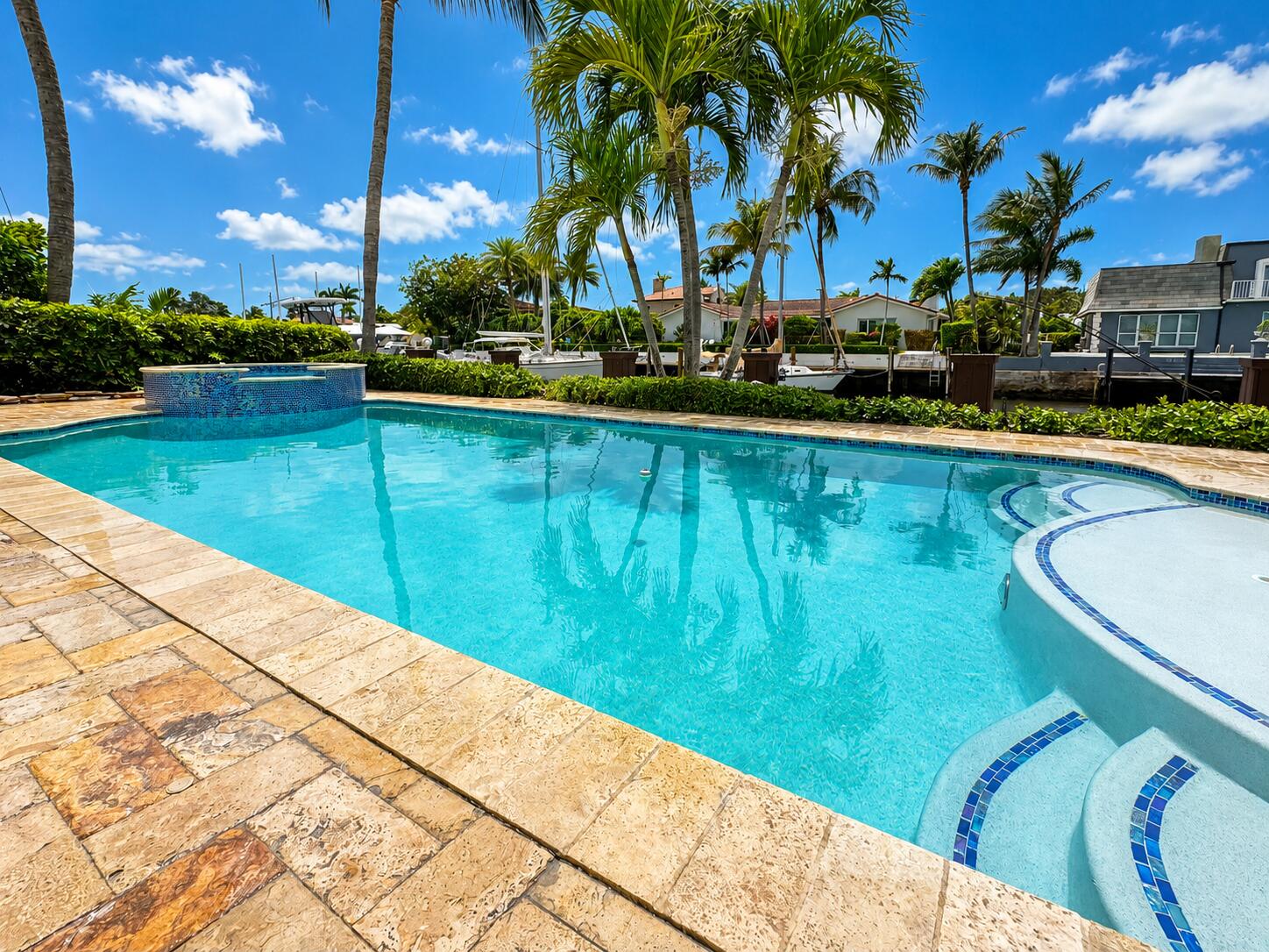 Experience luxury waterfront living in this stunning estate located in prestigious Lighthouse Point. Situated on a prime deepwater lot with no fixed bridges, this exceptional 6-bedroom, 5-bath residence offers direct ocean access and the ultimate South Florida lifestyle. Boasting 90+ feet of dockage on one of the widest canals in Lighthouse Point, this property is a true boater's paradise. Designed for both comfort and entertaining, the home features expansive living areas, elegant finishes, and breathtaking water views throughout. Enjoy resort-style outdoor living with spacious patios, a sparkling pool, and private dockage ideal for large vessels. A rare opportunity to own a premier luxury waterfront home in one of Lighthouse Point's most sought-after neighborhoods.