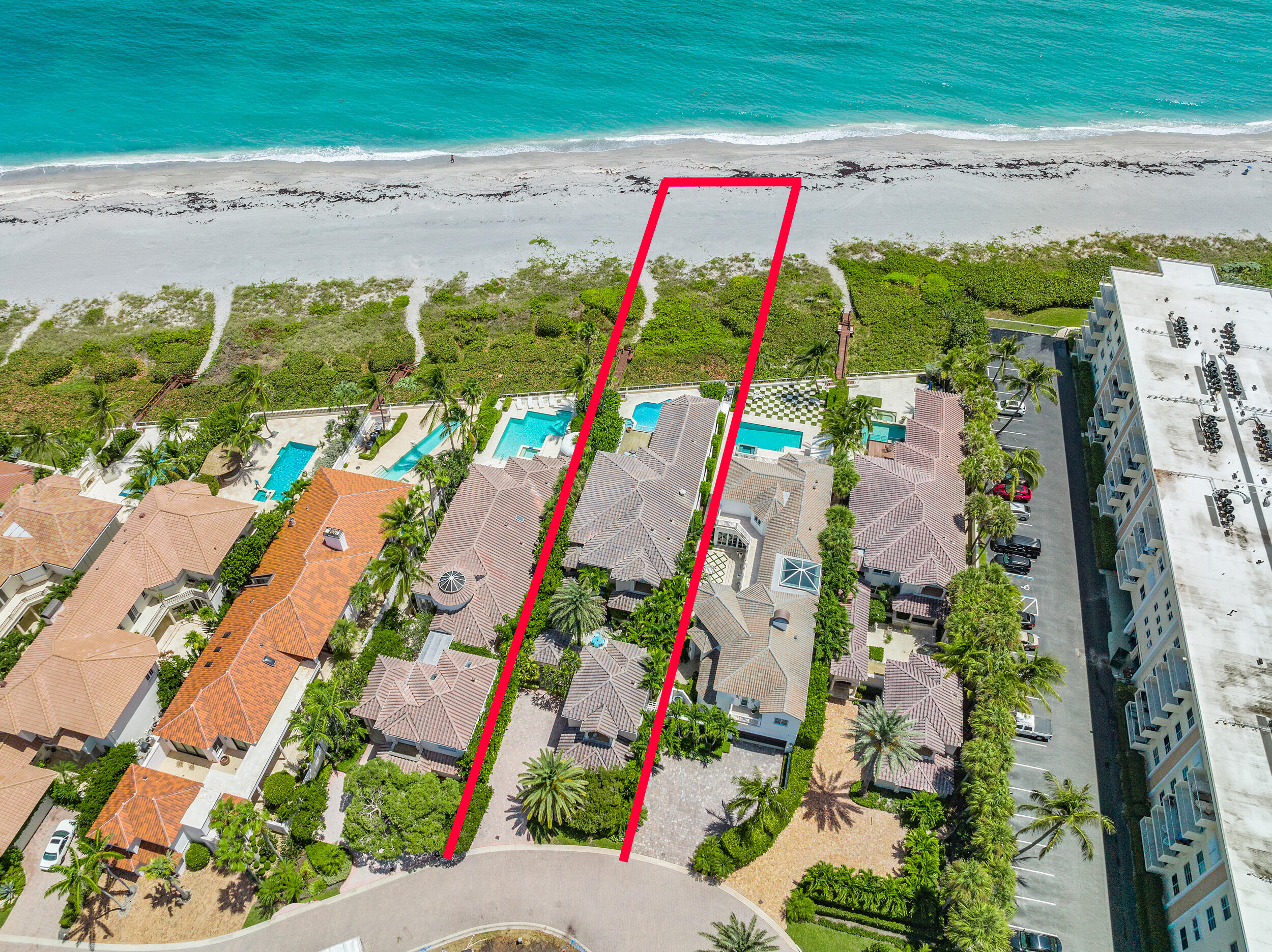 Seven Hundred Ocean is an exclusive Oceanfront gated enclave of only 10 homes.  Paradise is found... This residence is located directly on the sand of the Atlantic Ocean in Juno Beach.  Enjoy countless hours watching the surf and frolicking on the sand within feet from your back gate. As you enter your private courtyard you will be met with the turquoise blue water and cool ocean breeze.  The owners retreat has large picture windows and outdoor deck that overlooks the beach and ocean as far as the eye can see, dual closets and baths, wet bar and sitting area that will delight your senses everyday. In addition to the Owner's Retreat you will find a library/loft and a guest room with its own private bath. Spectacular never ending views from the living room, kitchen and family room. Large guest house with a private entrance from the main house with a living room, bedroom and bath located off the private courtyard. 
Seven Hundred Ocean is in a league of it's own in Northern Palm Beach County.  Close to shopping, airport, dining options and best of all it is located directly on the Beach.
This home will not be on the market long.