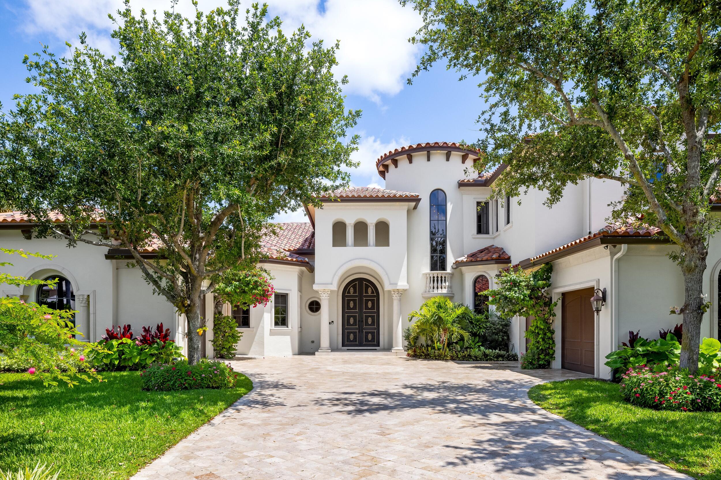 Step into luxury living at its finest with this magnificent custom-built modern Mediterranean home nestled in the prestigious gated community of The Sanctuary, one of Boca Raton's most coveted waterfront enclaves. Boasting unparalleled security with 24-hour roving patrol by both land and water, this exclusive community offers a serene and secure haven for discerning homeowners. 

Spanning an impressive 5,659 square feet of meticulously crafted living space, this six-bedroom residence exudes sophistication and elegance at every turn. Experience a clean, bright, and open floor plan adorned with exquisite finishes and architectural details throughout. Entertain in style in the spacious double-height living areas, highlighted by soaring ceilings that create an airy ambiance. The gourmet chef's kitchen is a culinary masterpiece, featuring top-of-the-line Wolf and Sub-Zero appliances, perfect for creating culinary delights for family and friends.

Escape to the luxurious first-floor primary suite, offering a peaceful retreat complete with a spa-like ensuite bath and expansive walk-in closets. A private office provides the ideal space for remote work or quiet reflection, while a state-of-the-art theater room offers endless entertainment possibilities.

Wine enthusiasts will delight in the 660-bottle climate-controlled wine cellar, perfect for showcasing your collection. Other notable features include a 48kw generator for added peace of mind, elegant white oak and ash marble flooring, and custom millwork throughout.

With your own private oasis, lush landscaping surrounds a sparkling saltwater pool, creating the perfect backdrop for outdoor gatherings. The summer kitchen and pecky cypress ceiling add a touch of sophistication to alfresco dining experiences, while dockage is available for rent at the private marina, offering convenient access to the waterways of Boca Raton.

Located just half a mile from the pristine beaches of the Atlantic Ocean, residents of The Sanctuary enjoy a lifestyle of luxury and convenience. Take advantage of the community's amenities, including a 23-slip marina, tennis courts, a basketball court, and playgrounds, ensuring endless opportunities for recreation and relaxation.

With its unrivaled security, prestigious location, and unparalleled amenities, this exquisite residence offers the epitome of Boca Raton living.