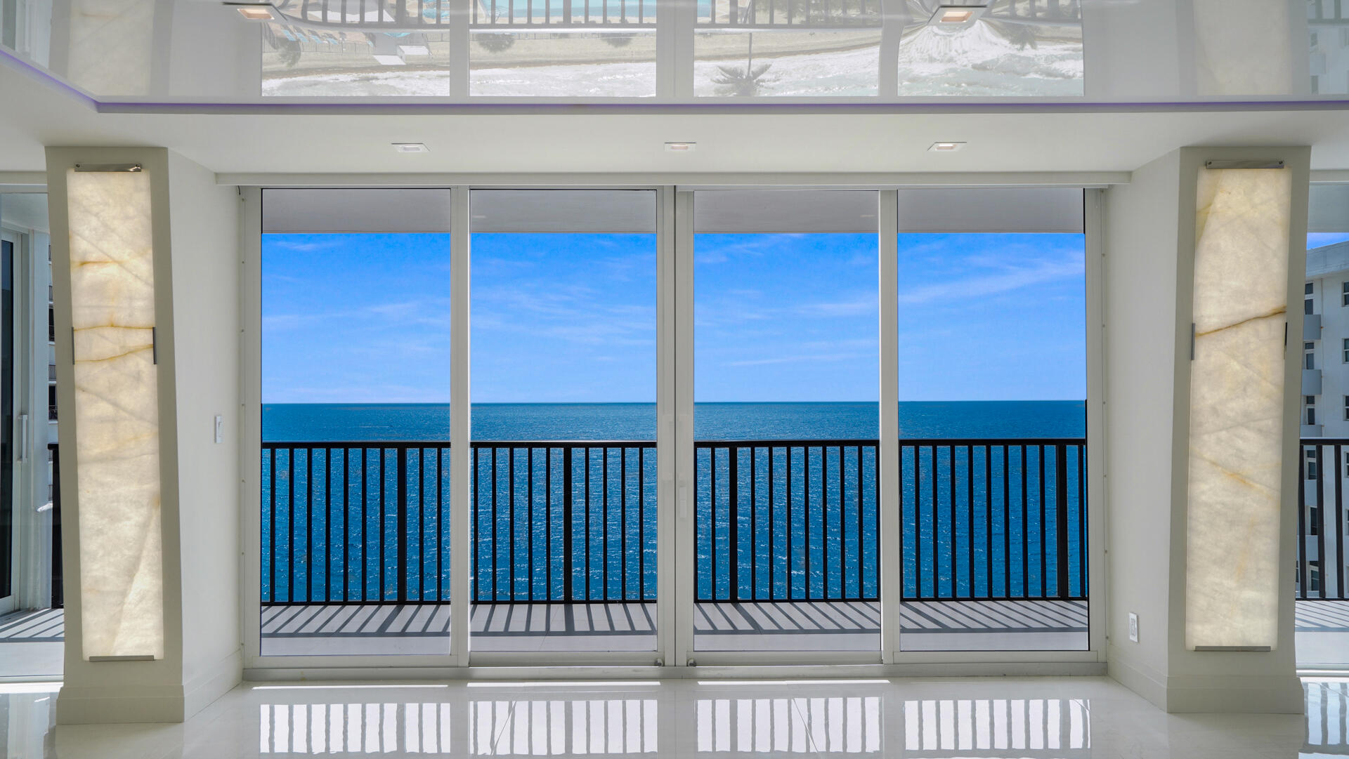 Experience unparalleled luxury in this gut-renovated 3BR/2.5BA corner unit at Plaza South on Galt Ocean Mile. Crafted by a builder with extreme attention to detail, this 2,400 sqft "through-and-through" residence boasts direct East oceanfront and West Intracoastal views. Stripped to the concrete, updates include new plumbing, electric, HVAC, and impact glass. Exquisite finishes feature 4'x4' floor tile, backlit Cristallo Quartzite countertops, and a custom Velum stretch ceiling with LED lighting. The kitchen offers Sub-Zero, Wolf, and Cove appliances. Enjoy motorized blinds, custom closets, and soundproofed walls. Directly on the sand in Fort Lauderdale, this is coastal living at its finest!