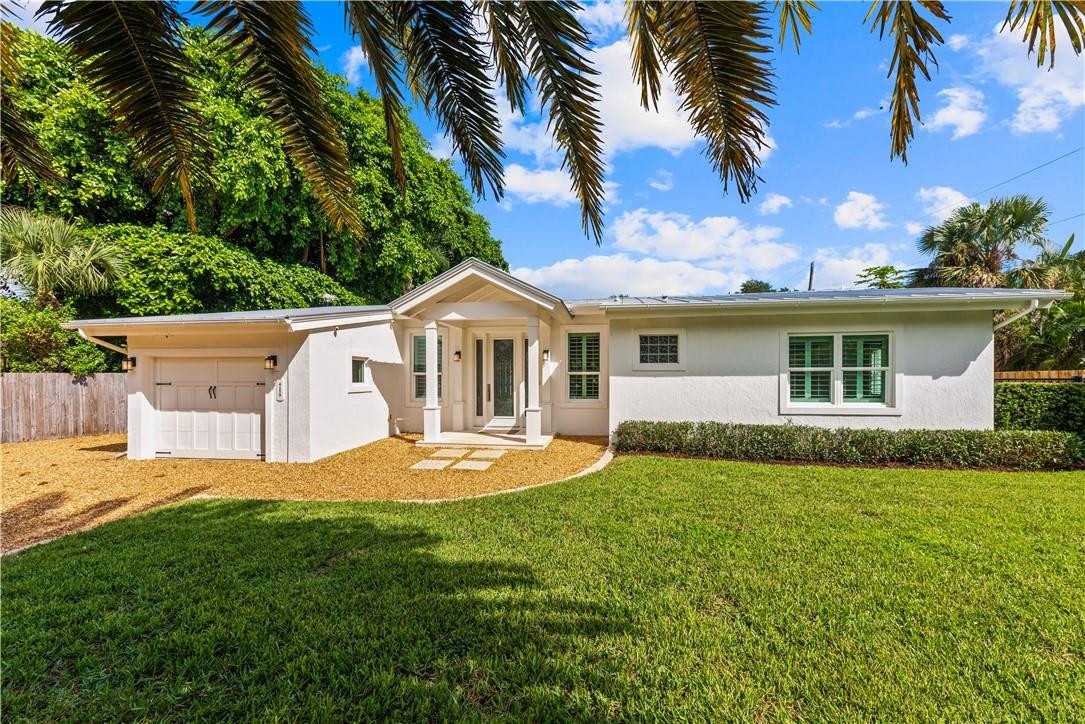 Completely renovated in 2014, this "Mini"-Mansion provides privacy and luxury in the desirable Old St. Lucie waterfront neighborhood. This home is nestled between 2 riverfront estates and combines a luxurious open concept with bungalow charm. Features include multiple large windows, vaulted cypress tongue & groove ceilings, porcelain tile, LED lighting, gourmet kitchen, Viking appliances, center Island, privatesetting and pool. Pool area features custom patio deck that includes real seashells in the concrete. Master bath features custom tile work, Victoria & Albert natural stone soaking tub, large walk in curb-less shower, and master closet with built-ins. Plantation shutters, lots of storage, pool cabana. CCTV system allows you to monitor the property while away. Complete property fencing with automated entrance gate creates a retreat feel while still only minutes from the beach, town, shopping, and all of the water sports you could ever hope for. 2014 renovation was a complete remodel of the property taking it back to the bare block and installing all new electrical, plumbing, HVAC (2units), roof, septic system, appliances, spray insulation, patio, impact windows and doors, kitchen, bathrooms, interior finishes, built-in cabinetry, and much more. The pool was also renovated in 2014 with an upgraded aggregate surface and a bench with whirlpool jets for relaxation. All pool and sprinkler equipment was replaced at this time as well. The quality and craftsmanship that went into this home has to be seen to be believed.