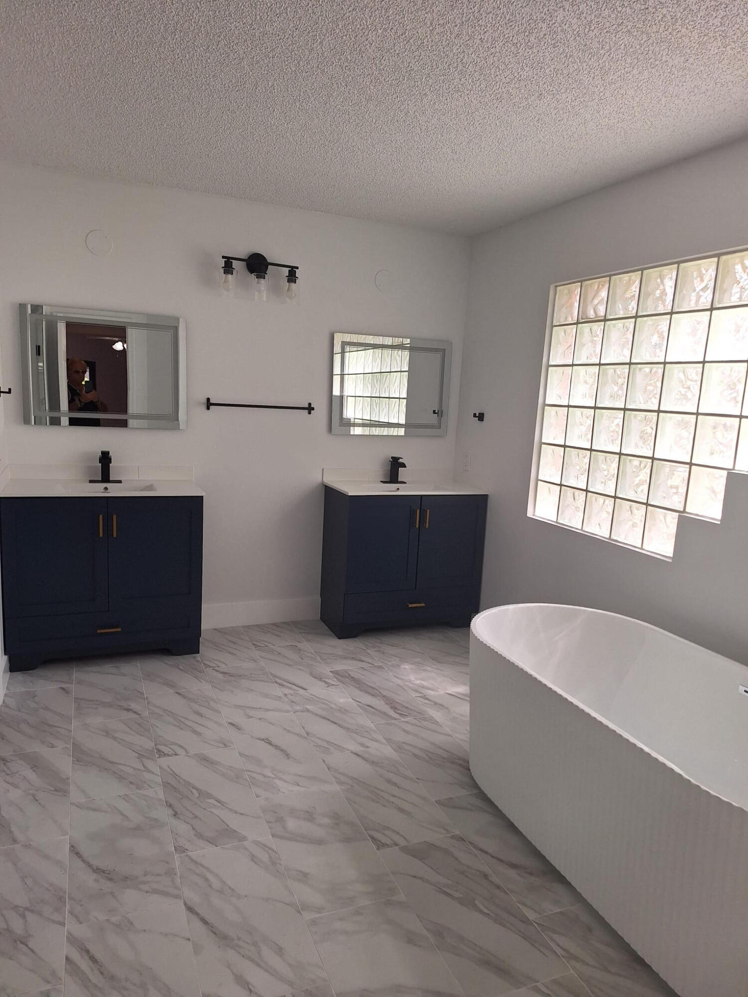 Welcome to this thoughtfully designed and completely remodeled 2-story residence in Jacaranda. This single-family home offers 2,350 square feet of finished living space across three bedrooms and 2.5 bathrooms plus large loft. Master suit and laundry closet located on the first floor. Corner house with Fenced back yard and Screened in patio off the kitchen,  living room and master bedroom. Community is secured by a gate during late evenings to early mornings.  Available for immediate occupancy. ** No Association application or approval needed**