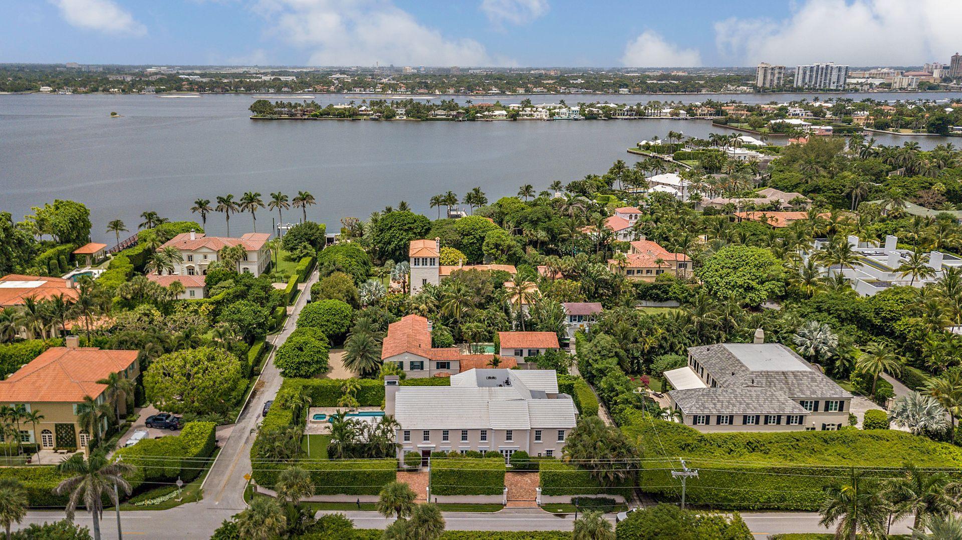 Stately and sophisticated, this 1930's Georgian sits in the heart of the prestigious Estate Section. Spacious, bright living spaces include entry foyer with 17' ceilings, proper formal dining room and living room, gourmet kitchen, library, office, 6 bedrooms and 7 ½ baths. This stunning home has gorgeous crown molding detail, walls painted by Italian artists, a 1200 bottle temperature controlled wine room, 19th Century Georgian mantels on Living Room and bedroom fireplaces, master with his & hers baths and extensive walk-in closets, surround sound inside and out, impact windows & doors, new roof and a full house generator capable of running all 14 tons of A/C. A 600+ square foot poolside loggia is breathtaking with (MORE) Cypress cathedral ceilings and fireplace. All this and deeded beach access!