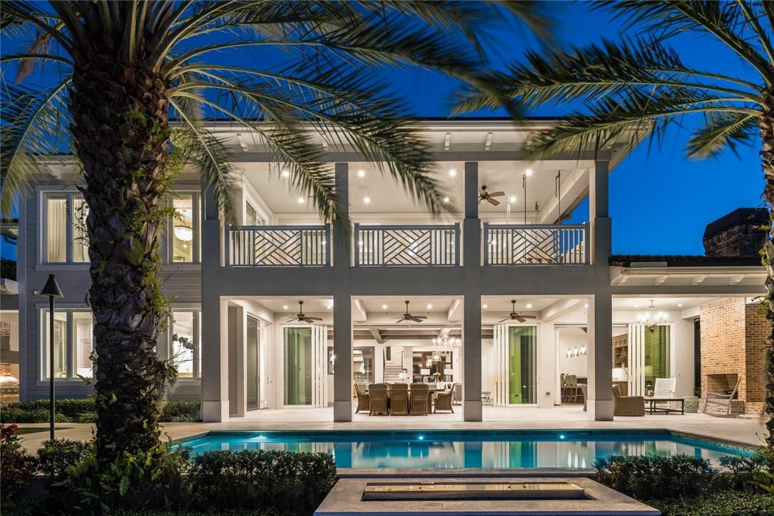 A Rio Vista DREAM HOME. Step into the 2-story, 3-car 2017 British West Indies style home featuring 6 beds, 6.1 baths, oversized primary suite with walk in closets, state of the art interiors of natural woods and meticulous mill works throughout. The perfect home for entertaining all and enjoying family. Stunning bar room and gourmet kitchen between a vast open great room full of sliders to open the entire room, overviewing the pool and waterfront. 100ft of dockage, boat lift and floating dock. The perfect set up that cruises you minutes to the ocean. Enjoy the outdoors underneath the fanned cantilever roof featuring a fireplace, summer kitchen, astroturf landscaping for easy maintenance, and gorgeous exterior lighting that keeps the home glowing at night. Heated pool and house generator.