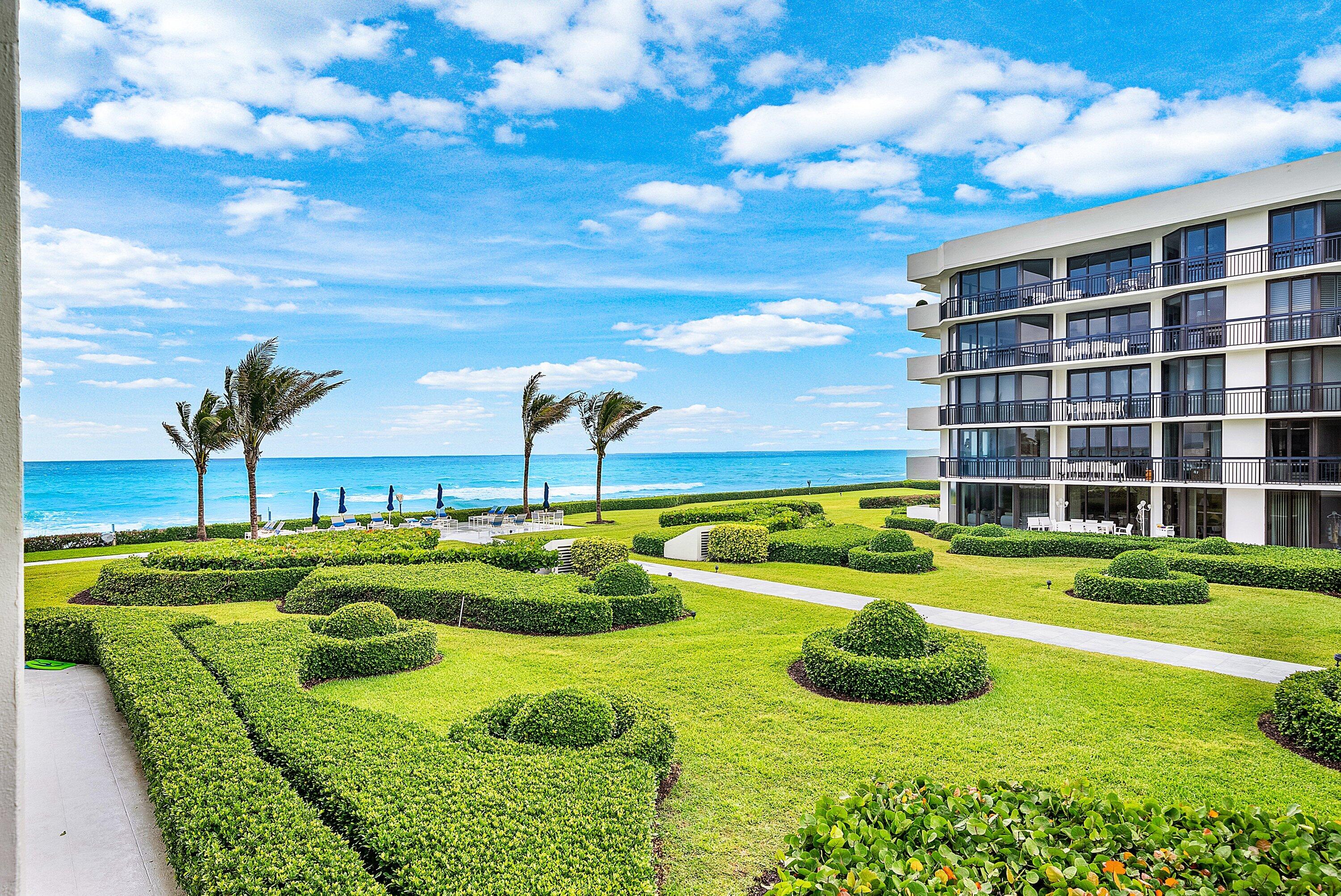 Move right in to this renovated 2BR + DEN & 2BA split-plan has south facing views of the ocean, Intracoastal, gardens & pool area. Inside this spacious floor plan you'll find excellent workmanship and beautiful detail. The galley style kitchen has white custom cabinetry, stainless steel appliances & a breakfast room offering stunning views. The primary bedroom is light & bright with 2 custom walk-in closets. The primary bathroom been redesigned using stylish porcelain and offers a  large walk-in shower, tub & custom cabinetry. The guest suite & den provide privacy and comfort for family and friends. Carlton Place is a luxury oceanfront complex with a manned gatehouse, newly renovated fitness area & pool, hot tub and BBQ area, beach pavilion with lounge chairs & umbrellas & 2 Garage  Spaces