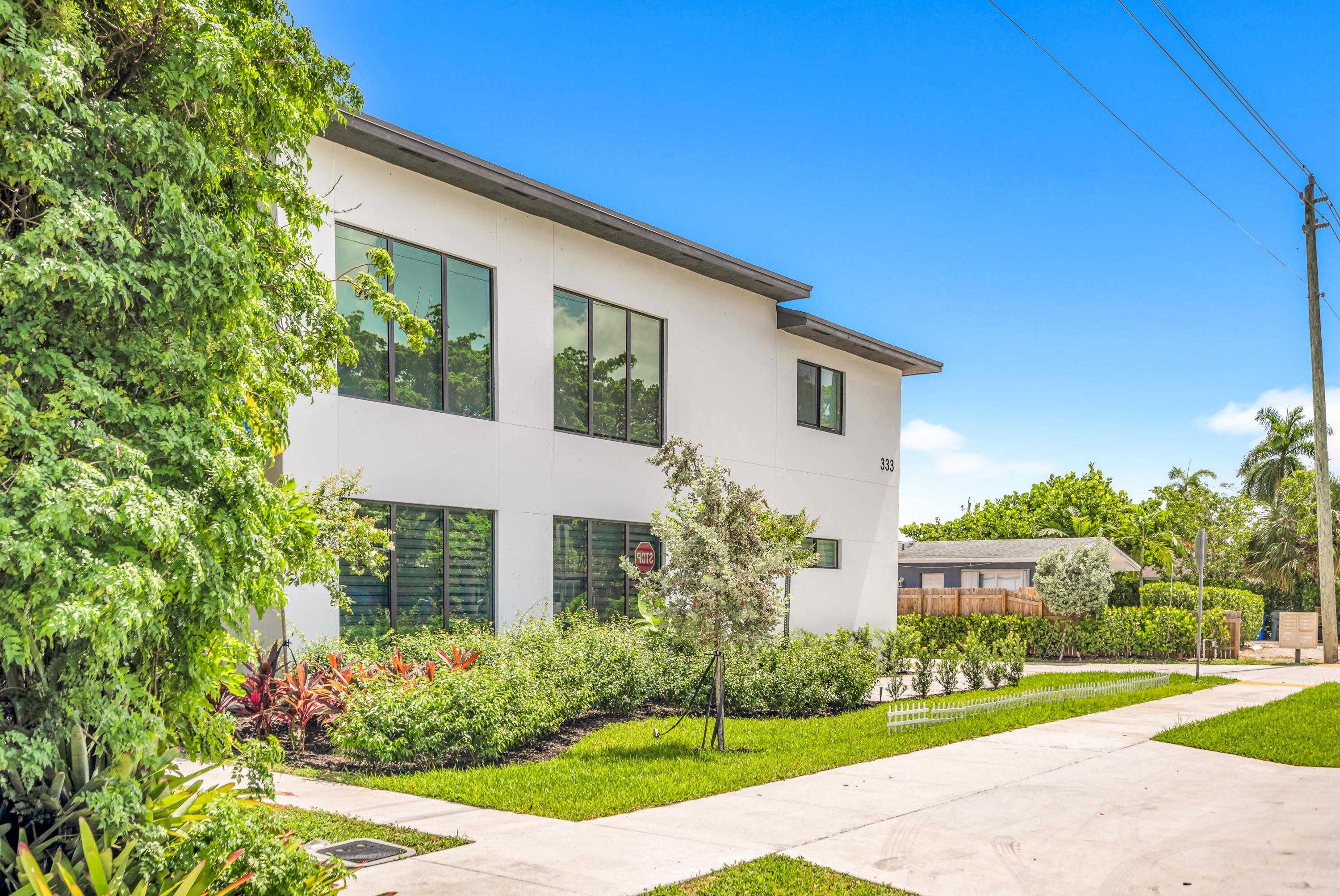 Welcome to this stunning **brand-new 2025 townhome** offering **3 bedrooms, 2.5 bathrooms, and approximately 2,200 square feet** of thoughtfully designed living space. With the feel and comfort of a single-family home, this exceptional residence is located in the thriving city of Oakland Park.  Pull into your private **two-car garage** and step into a bright, open-concept floor plan featuring soaring **12-foot ceilings**, impact-resistant windows and doors, and a beautifully designed kitchen complete with **quartz countertops** and brand-new **stainless steel appliances**. A convenient half bath on the main level is perfect for guests.  Upstairs, the spacious primary suite offers a private balcony, dual vanities, and a spa-like atmosphere. The split-bedroom layout provides added privacy, w