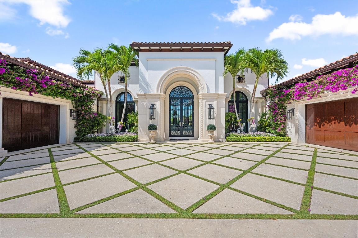 Welcome to 12521 Cypress Island Way, a stunning residence located in the prestigious gated enclave of Palm Beach Polo. This custom built estate offers the perfect blend of timeless elegance and modern comfort, with sweeping water and golf course views. This home boasts an expansive open floor plan with soaring ceilings, designer finishes, and abundant natural light. The chefs kitchen features a La Cornue range. The luxurious master suite offers his and her bathrooms, spacious walk in closets, and a sitting room.  The four additional bedrooms all have private ensuite bathrooms. The resort style backyard has a covered loggia, summer kitchen, pool, spa, and immaculate landscaping creating a true private oasis. Minutes from WEF and IPC this home offers the ultimate Wellington lifestyle.