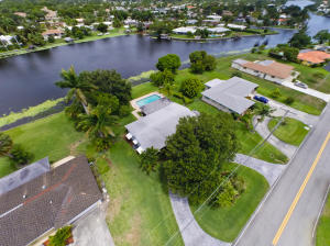 Priced at lot value! This 3/2 home is ready for your renovations or to be knocked down for your new dream home. Either way, you will feel like you are always on vacation living on this stunning lakefront lot with panoramic water views. Previously listed for $359,000, this home immediately went under contract, but settlement issues discovered during inspections caused the first deal to fall through. Owner wishes to sell quickly and has reduced the list price. Engineer's report states it may cost $50,000 plus to stabilize current home. Considering the price reduction, renovating this special home or building a new home make either choice a viable option. Enjoy living in Lake Clarke shores, one of the best communities in South Florida!