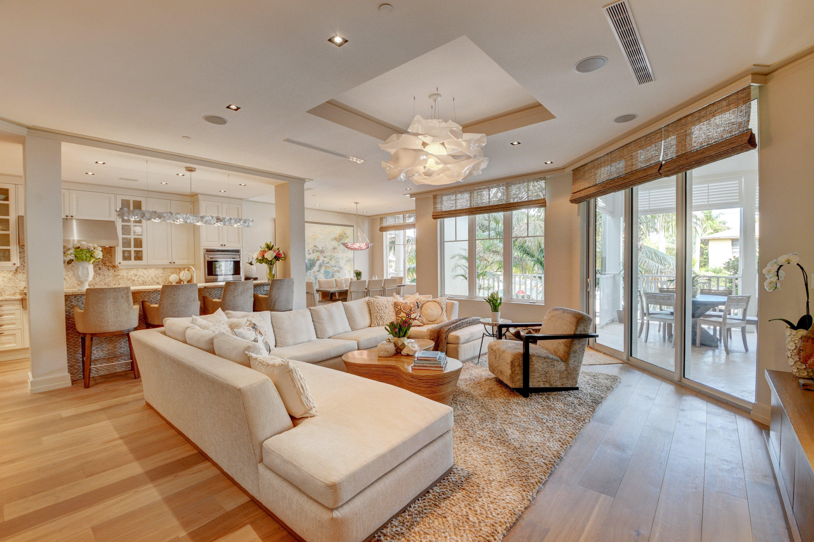 Designer Chris Leighton's masterful sense of timeless elegance is immediately felt upon entering this beautiful home. His redesign of the original floor plan to a three bedroom, three and a half bath, office and enlarged laundry room allows for the optimal use of living space. Exquisite wall coverings, chandeliers and cabinetry are found throughout. Very large covered balcony accessible from both living room and master bedroom allows for comfortable outdoor living.Ten foot ceilings coupled with impact glass sliding doors & windows provide natural light .Designer kitchen is equipped with Wolf gas range/ grill/griddle and double ovens,Sub Zero fridge and wine cooler, and built in Miele cappuccino/espresso machine. Membership to both The Seagate Beach Club and Golf & Country Club are included The exclusive Seagate Residence is fully staffed with concierge, valet,security and building manager. Updated second floor common area lounge with outdoor terrace featuring ocean views.  The courtyard boosts tranquil koi ponds with colorful lilly pads and swaying palm trees. Inviting large heated pool with spa, and summer kitchen awaits for all to enjoy. This exceptional home may be purchased furnished. Chandelier in master does not convey.