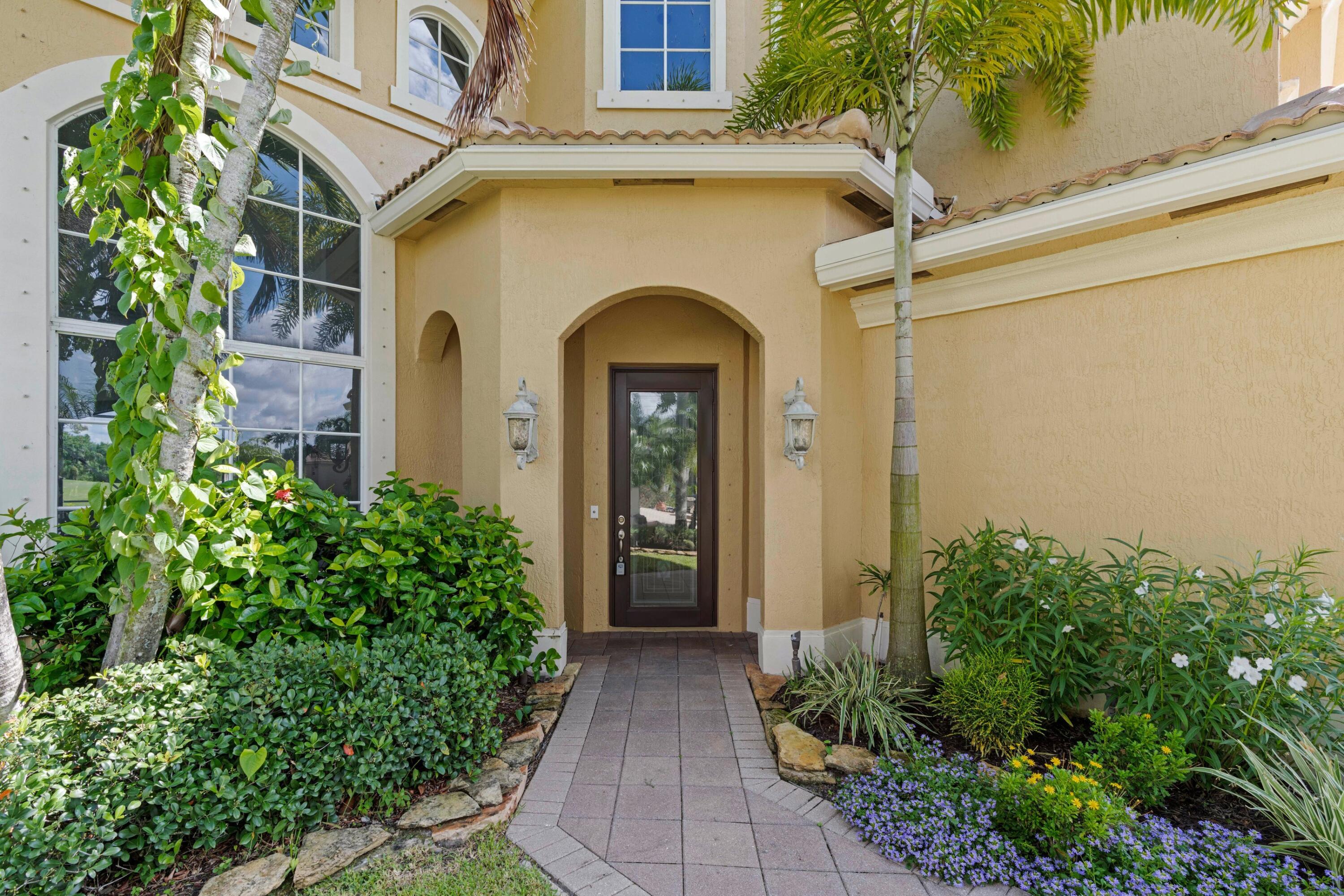 Welcome to this stunning 5-bedroom, 4-bathroom residence in Madison Green 1, Royal Palm Beach, offering 4,267 square feet of sophisticated living space across two stories. This single-family home features a 3-car garage and sits on a waterfront lot, providing a unique setting that combines convenience with natural beauty. The thoughtful floor plan accommodates multiple bedrooms and bathrooms, making it well-suited for those seeking substantial square footage and flexible living arrangements. This waterfront property in Madison Green 1 presents an exceptional opportunity to enjoy residential living with distinctive character. New roof in 2024.
