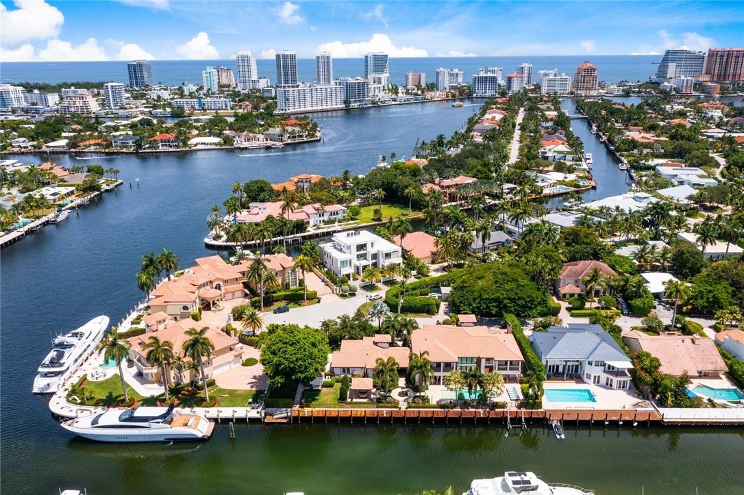 200 FT DEEPWATER, One off the Point with TWO LEGAL LOTS, 25,400 SF lot! Ultimate deepwater compound for boating & car enthusiasts, beautiful views & superior location for large/multiple yachts. Guardhouse secured Seven Isles. West Coast contemporary architecture/transitional interiors! Developer's custom residence. Great floorplan, Chef's kitchen, wet bar, elegant formal living & dining room, family, club rooms. 1st level 2 bedroom suites (inc totally private VIP suite/2nd primary), cabana bath/dressing room. 2nd level:2 bedroom suites, office/gym, ultra-luxurious spacious primary suite, 2 closets, spa style bath, private balcony. Resort-style pool area, large covered terrace, summer kitchen, bar/seating area, 7 bay garage (4 a/c) garages, room to expand additional bedroom/play area 6th bedroom upstairs is currently being used as an office.