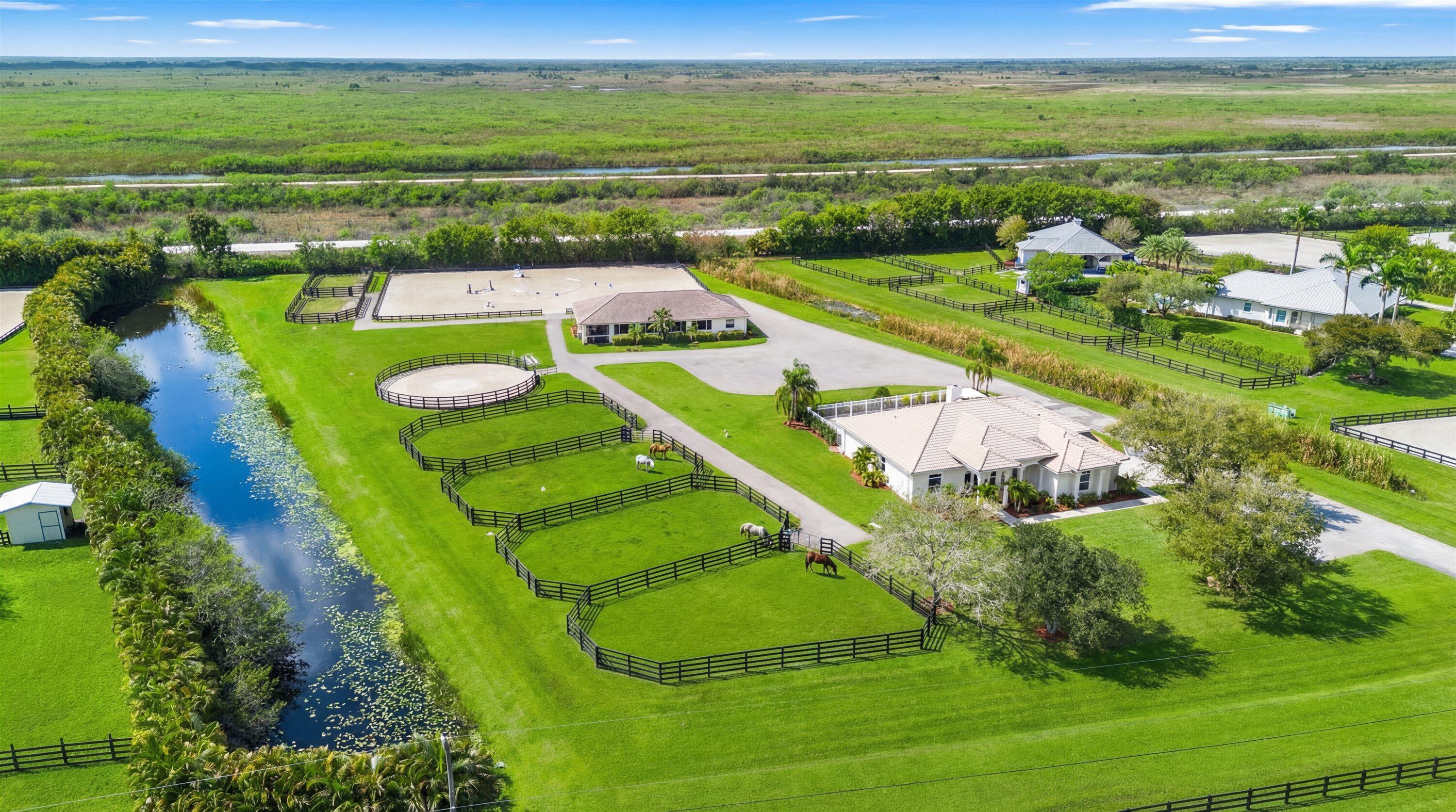 Set on 4.33 acres, this turnkey equestrian property features a beautifully updated 4 bedroom home with a split floor plan, spacious kitchen, new HVAC, fresh interior paint, new fixtures, & a resurfaced saltwater pool with new equipment and heater.  The farm has been extensively improved with a new well, full-property irrigation, a 125' x 175' ESI all weather arena, 60' all weather round pen, 6 paddocks, underground drainage, and imported clean fill. The barn features 8 stalls with new stall doors, window bars, yokes, shutters, rubber mats, fresh paint, new AC in the tack and feed rooms, and new stall fans.  Additional upgrades include a newer RO system, & landscaping.  The property offers ample truck & trailer access and allows for expansion to 16 stalls .  Enjoy exceptional sunsets and a  fully modernized equestrian facility ready for immediate use.