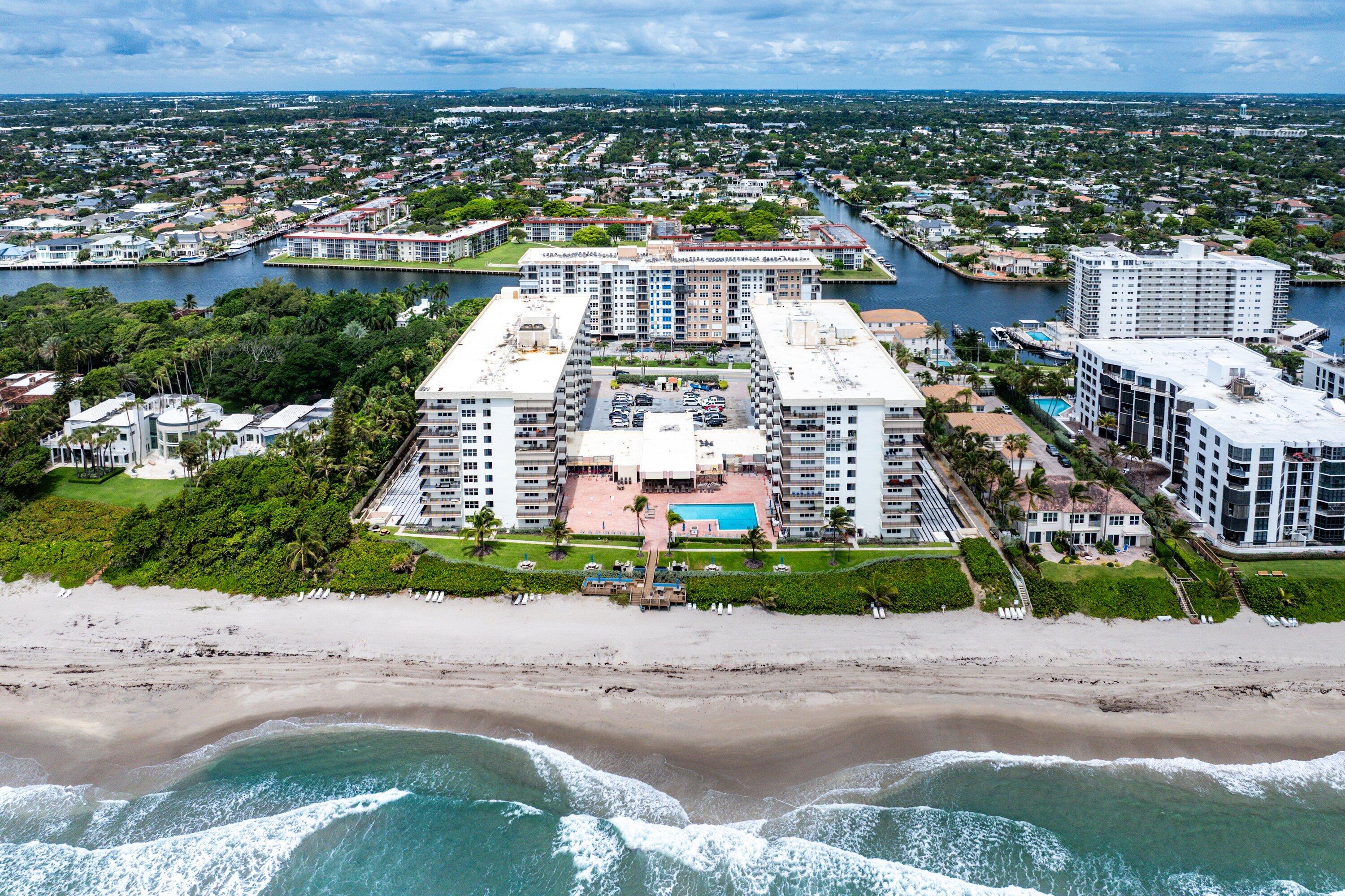 Experience the best of waterfront living along prestigious Hillsboro Mile. This spacious 2-bedroom, 2-bath residence offers breathtaking Intracoastal views from the living room, both bedrooms, and private balcony, creating the perfect backdrop for enjoying spectacular sunsets and watching boats cruise by. The updated kitchen features white shaker cabinetry, quartz countertops, stainless steel appliances, and abundant storage. A desirable split-bedroom floor plan provides comfort and privacy, while private deeded beach access to the Atlantic Ocean just across the street allows you to enjoy the best of South Florida's coastal lifestyle. Residents enjoy access to resort-style amenities including two pools, fitness facilities, clubhouse spaces, and private beach access. Ideally located between Boca Raton, Deerfield Beach, and Pompano Beach, you'll be minutes from dining, shopping, marinas, and entertainment. Whether you're looking for a year-round residence, seasonal escape, or investment opportunity, this is your chance to experience the best of the Florida waterfront lifestyle.