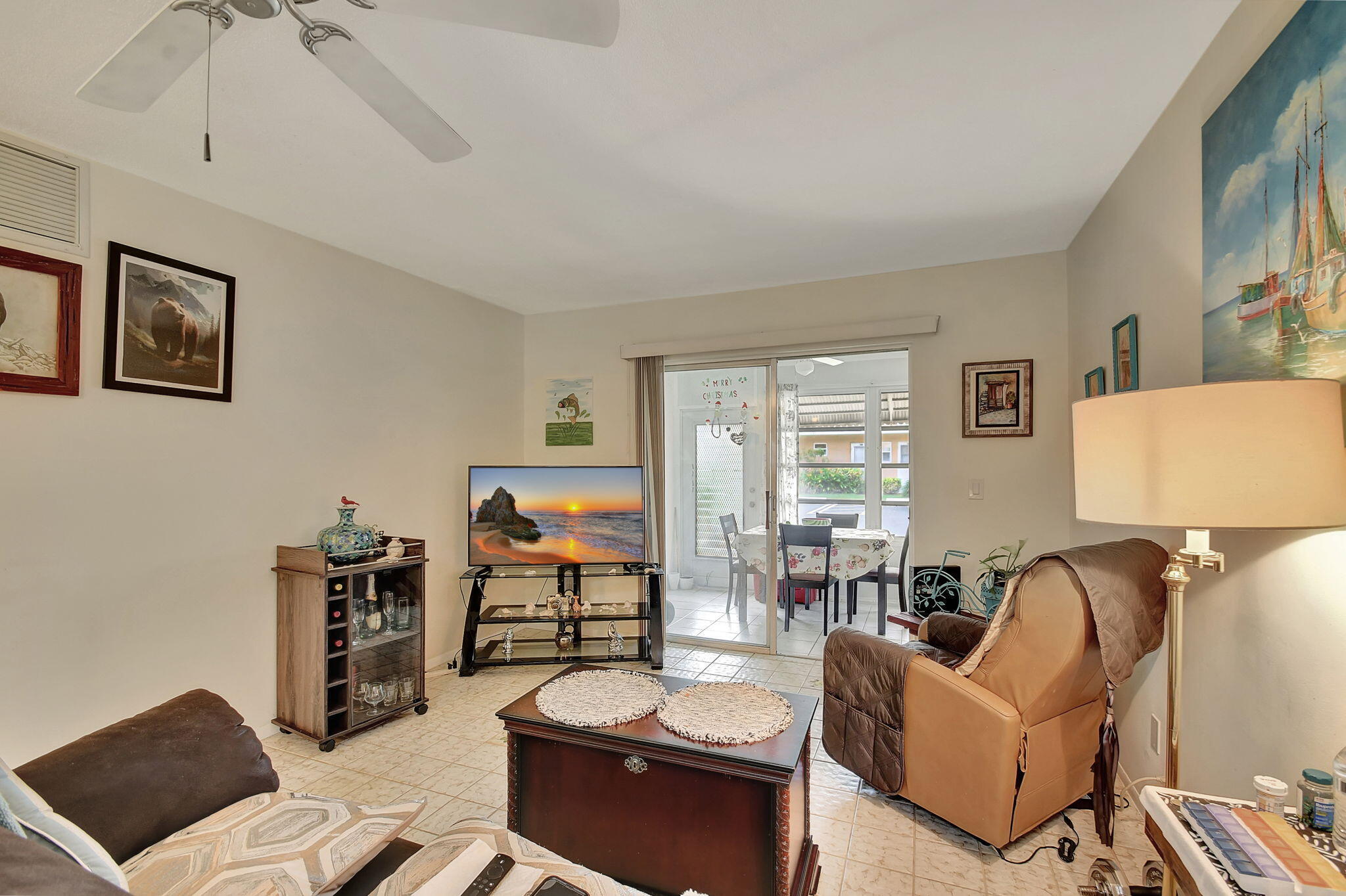 Live your best Florida life in this meticulously maintained ground-floor condo in the vibrant 55+ Village Royale Greendale community, which combines comfort and modern style. The residence is fully move-in ready and has updated engineered flooring in the bedrooms, newer appliances, and a newer air-conditioning system. The kitchen sparkles with Frigidaire appliances, granite countertops, and an eye-catching hexagonal tile backsplash. Crown molding adds architectural elegance. It is spacious and thoughtfully designed, offering a clean, welcoming ambiance in every room. Residents enjoy a lively social scene with access to a clubhouse, pool, and shuffleboard courts. Ideally located close to shopping, dining, and a short distance to stunning beaches.