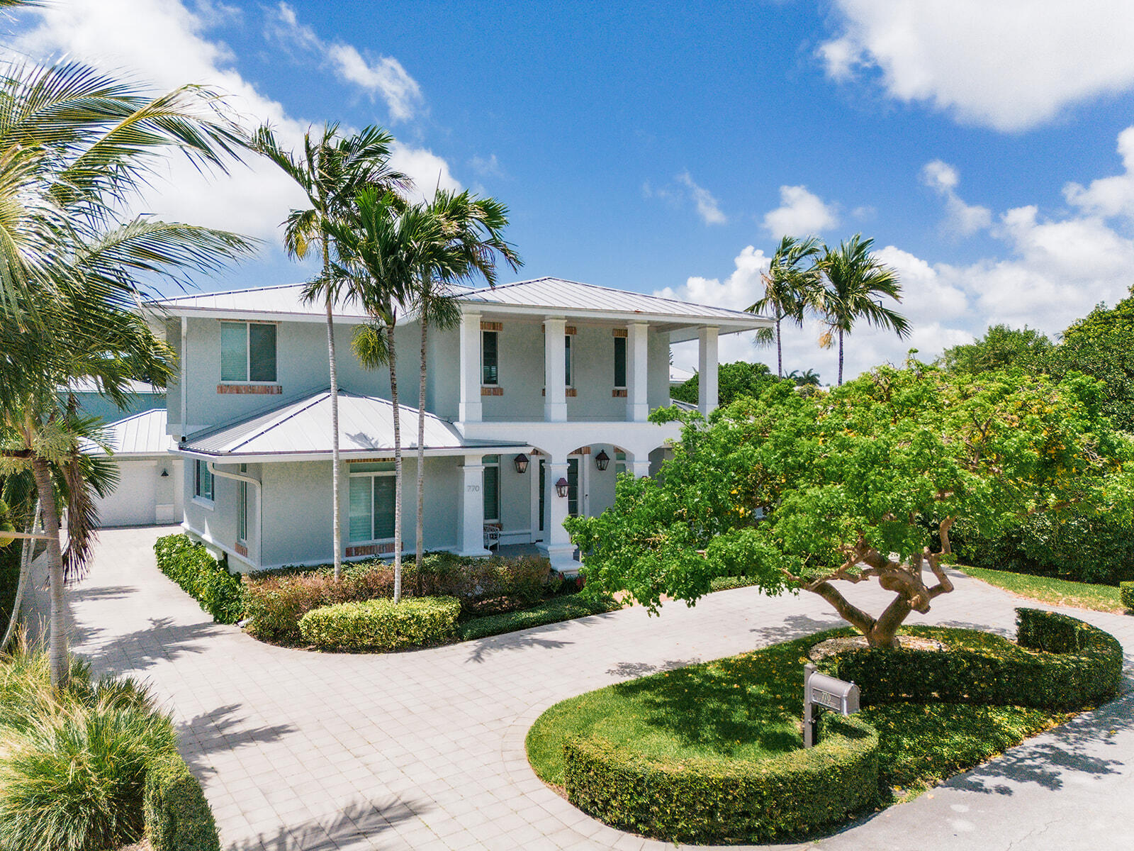 This Boca Riviera home is one of the best finds in Boca! Custom built, this Contemporary Key West style residence is right off A1A, just blocks from the ocean and intercostal. Features include volume ceilings; wood floors; open floor plan; five bedrooms plus office; kitchen with custom glass cabinets and island; spacious den on second floor landing; and first floor primary wing with a wall of sliders, walk-in closet, and bath plus private outdoor shower. Enjoy the resort style heated saltwater pool with open patio and outdoor shower. The circular drive adds to the incredible curb appeal with a side long driveway to the two-car garage that is converted to a guest quarters plus one-car garage. Located just minutes from Mizner Park in Downtown Boca Raton, this is truly a special opportunity! FEATURES -Custom built Contemporary Key West design by Architect Rick Brautigan -5 bedrooms plus office / 4.1 baths -3,172 square feet under air / 3,766 total square feet -Boca Raton Riviera beachside neighborhood just blocks from the beach and about a mile from downtown Boca Raton & Mizner Park -Circular drive and manicured landscape -Hardwood floors and volume ceilings -Living room with wet bar and easy access to the pool -Dining area conveniently located between the kitchen and living room -Kitchen with newer quartz countertops, island with snack bar seating and custom glass cabinets -Primary wing with bedroom, walk-in closet and bath with tub, shower and outdoor shower -4 additional guest rooms  -Dedicated office -Laundry room with newer washer and dryer -Custom saltwater heated pool with glass bead surface - Regulation lap length at longest points -Open poolside patio, outdoor shower and custom deck overlooking the pool -Impact glass windows and doors -Whole house generator -2 AC zones plus splitter unit in garage   UPDATES -Complete Interior Paint (2024) -Complete Exterior Paint (2024) -Miele Clothes Washer & Dryer with Extended Warranty (2024) -Smoke detectors replaced throughout home (2024) -Dual DAIKON Central Air Conditioning (2023) -Culligan Soft Water System (2023) -Custom Quartz Kitchen Countertops (2023) -Reverse Osmosis Drinking Water & Ice (2023) -LG "Craft Ice" Refrigerator (2023) -Garage Door Motor (2022) -Whole House, Integrated Automatic Emergency Generator (2022) -Rain Gutters (2020) -Glass Bead Pool Surface (2020)