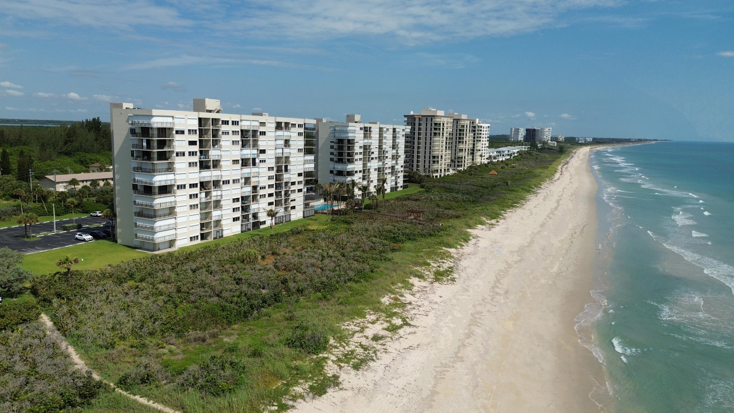 Welcome to island living at its finest! This beautifully maintained beachfront condo offers a desirable peek-a-boo ocean view and is just steps from the sandy shores of the Atlantic Ocean. Featuring impact windows for added peace of mind and storm protection, this coastal retreat combines comfort, convenience, and the relaxed lifestyle you've been dreaming of.  The kitchen is enhanced with stainless steel appliances installed in 2023-2024. This condo also features a new A/C system installed in August 2024 that remains under warranty. Enjoy morning sunrises, ocean breezes, and all that island life has to offer. Whether you're looking for a full-time residence, seasonal getaway, or investment opportunity, this beachside gem is the perfect place to call home.