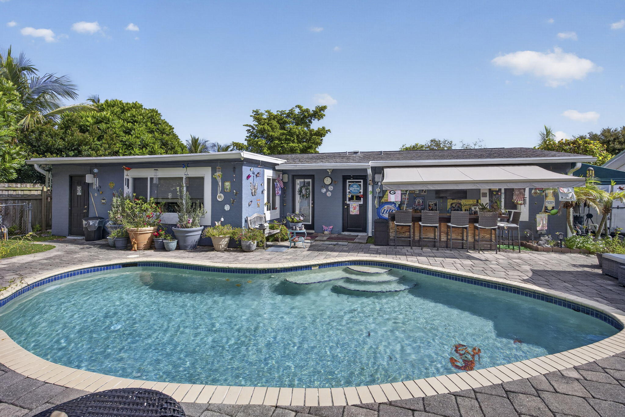 Location! Location! Location! Ideally situated in one of West Palm Beach's most coveted Intracoastal neighborhoods, this home is just moments from top-rated schools, including South Olive Elementary, as well as premier shopping, dining, downtown West Palm Beach, and Palm Beach International Airport. Enjoy the best of South Florida living with your own private pool and hot tub in the highly desirable, established SoSo neighborhood with no HOA, just steps from the Intracoastal Waterway and minutes from pristine beaches. Surrounded by stunning multi-million-dollar new construction, this is a rare opportunity to own in one of the area's most sought-after neighborhoods, where luxury, convenience, and exceptional long-term value come together.