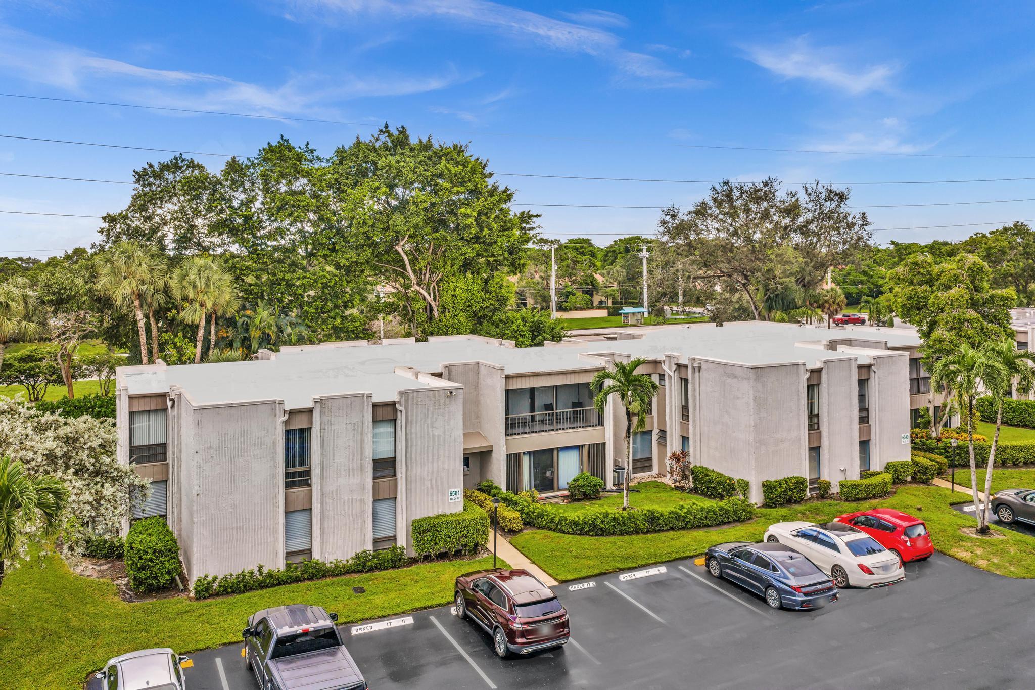 Discover exceptional space, comfort, and convenience in this beautifully maintained 3-bedroom, 2-bath residence located in one of Boca Raton's most desirable 55+ communities. Offering 1,700 SF of living space, this second-floor condo is surrounded by tranquil nature views, creating a peaceful retreat while remaining close to everything Boca Raton has to offer. Filled with natural light, the spacious floor plan features expansive living and dining areas that flow seamlessly into an enclosed balcony, providing additional year-round living space perfect for relaxing, entertaining, or enjoying the serene surroundings. The kitchen is thoughtfully designed with ample cabinetry, generous workspace, and easy access to the main living areas, while both bathrooms have been tastefully updated for  modern comfort. Additional features include a full-size washer and dryer, assigned parking, and private first-floor storage. Residents enjoy added peace of mind with a community-wide roof replacement completed in 2023. Woodhaven offers an impressive array of amenities, including two heated pools, a clubhouse with a full kitchen, library, card room, billiards, exercise equipment, barbecue area, and both indoor and outdoor gathering spaces. Maintenance includes water, sewer, trash removal, Xfinity cable, and high-speed internet, providing outstanding value and carefree living. Ideally situated in the heart of Boca Del Mar, residents enjoy miles of scenic sidewalks for walking and biking, along with easy access to Town Center Mall, shopping, dining, supermarkets, medical facilities, and Boca Raton's beautiful beaches, all just minutes away. A rare opportunity to enjoy spacious, low-maintenance living in a prime Boca Raton location.