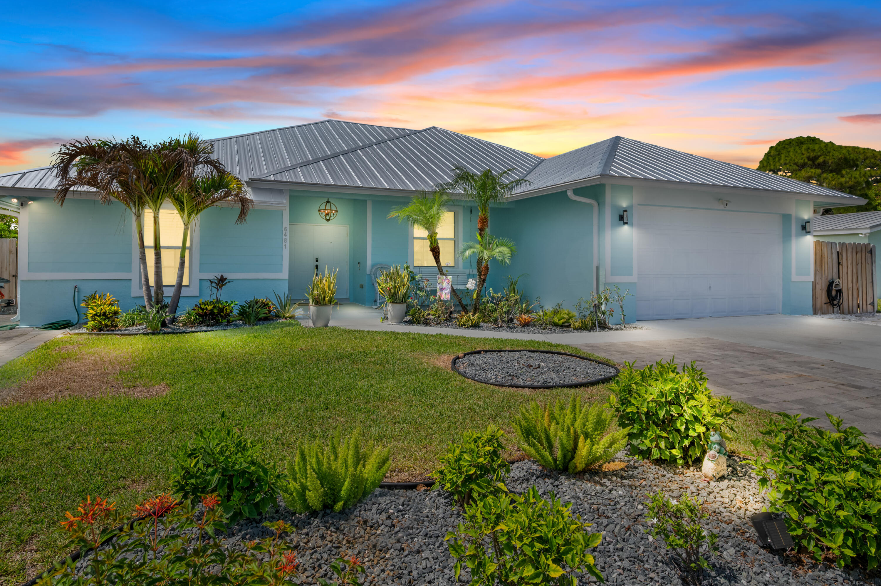 NEW METAL ROOF 2025!!!  2025 A/C and 2026 Water Heater WOW! This spacious 4-bedroom, 2.5-bath single-family home has so much to offer, including a NEW ROOF and NO HOA! Perfect for buyers who need space for their toys, this property features two side driveways with room for RVs, boats, trailers, or extra parking.  Inside, you'll find an open-concept layout with spacious living areas, tile flooring throughout, and a portion of the garage converted into a convenient office/flex space. The fenced backyard is built for entertaining, featuring a large screened-in patio with three ceiling fans, a mini kitchen, a half bath, and plenty of room for a pool table, gatherings, or relaxing with friends and family.  Step outside and enjoy the built-in BBQ area and an oversized yard with plenty of room to add a pool. With no HOA, a new roof, flexible parking, and incredible indoor/outdoor living space, with Ring cameras all around the outside of the home for added security.  This home is a must-see!