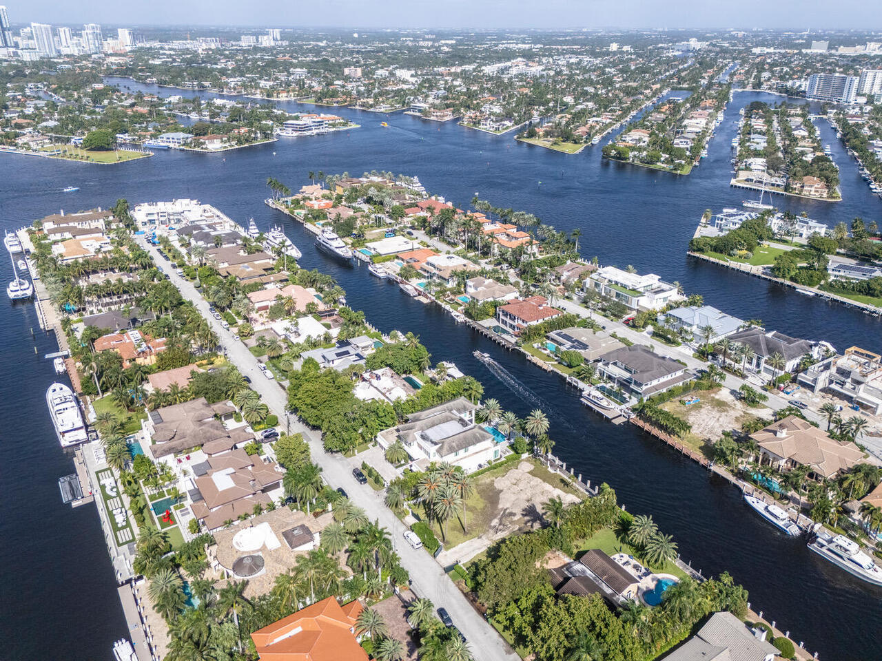 Exceptional Waterfront One off the Point, with Outstanding Point Lot  Views. It truly has exceptional point lot views due to the location of the open/wide Intracoastal Waterway intersection.  110 feet of waterfront with protected deeded dockage that sets way back from the Intracoastal intersection. This home sits on the best street in Harbor Beach. Harbor Beach is the most prestigious waterfront community in Broward County with the deepest water, largest lots and closest to the Port/Ocean.  Harbor Beach/gated community  has 24 hour Ft. Lauderdale Police surveillance and 300 feet of private ocean front with its own private marina. There are only 250 waterfront homeowners in Harbor Beach.