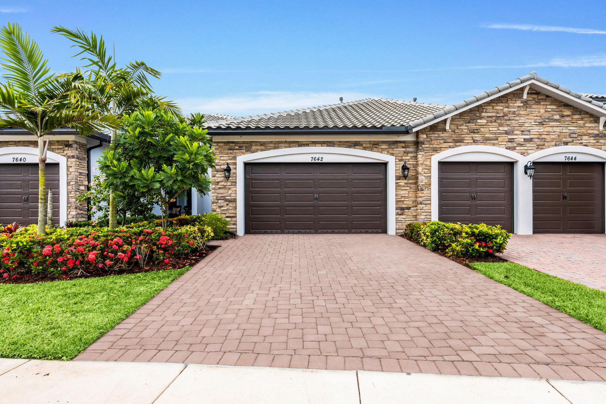 Fab Immac. Spacious FULL 3 Bdrm /2 Bth Villa W/natural lighting, extended pavers on patio with SERENE WATER view to enjoy coffee or cocktails.. Do not miss impact windows/doors  plus  a full 2 car Garage! Thousands spent in Builder upgrades and Additional seller upgrades. Ceramic floors thru-out, French doors, stainless Appliances , custom backsplash, custom fitted closets, tray ceilings Contemporary lighting /multiple paddle fans. Inside Separate Laundry room with high end gas dryer. Enjoy this Premier newer 55+ plus gated community w/resort style amenities including clubhouse w/heated pool,  gym, pickleball ,cafe, card rooms. Activities and Shows in their Theatre/much more.. This villa has extra guest parking very close. Additional  pickle ball courts JUST for the Villas...