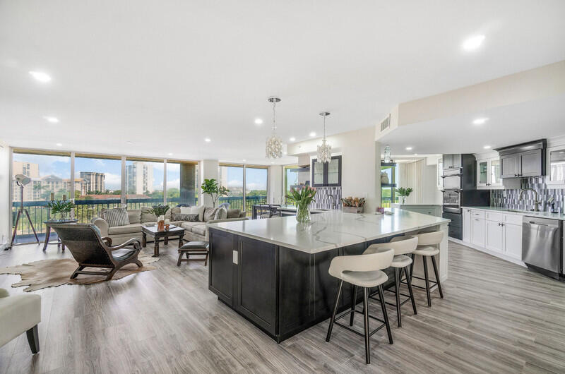 This impeccably renovated 3 BR, 2 Bath home blends modern elegance with effortless living. The open-concept design showcases a beautiful chef's kitchen, with wall oven and great appliances and island with quartz countertops, ideal for entertaining, while the expansive wrap-around terrace creates a seamless outdoor-indoor lifestyle. Every room has floor to ceiling window/doors that allow to enjoy great views. Set with-in a full-service deluxe building that has completed all legally required upgrades, this residence offers sophistication, security and turnkey convenience. The condo has a brand new AC,  the terrace was just redone. Also the electric is new with special lighting throughout the unit. The walls and ceilings are smooth, the floor is a convenient easy to maintain wood like vinyl. As soon as you enter the building you feel luxury with a beautiful renovated lobby, white glove full service with 24/7 concierge, daily Valet Golf cart 5 to 11 PM , full time manager on site, maintenance cleaning crew.  The location is prime on Dutchman's Pipe Golf and the Belgrove Marriott Autograph resort next door as well as the Tanger Outlet Mall with Wholefoods, Saks of Fifth, Ralph Lauren and much more, stores and restaurants and only minutes from PBI Airport, Palm Beach Island with its beaches, great restaurants and Worth Avenue with World class de luxe shops and galeries , and Downtown West Palm Beach with Kravis Center of Performing Arts, State of the Art Norton Museum,